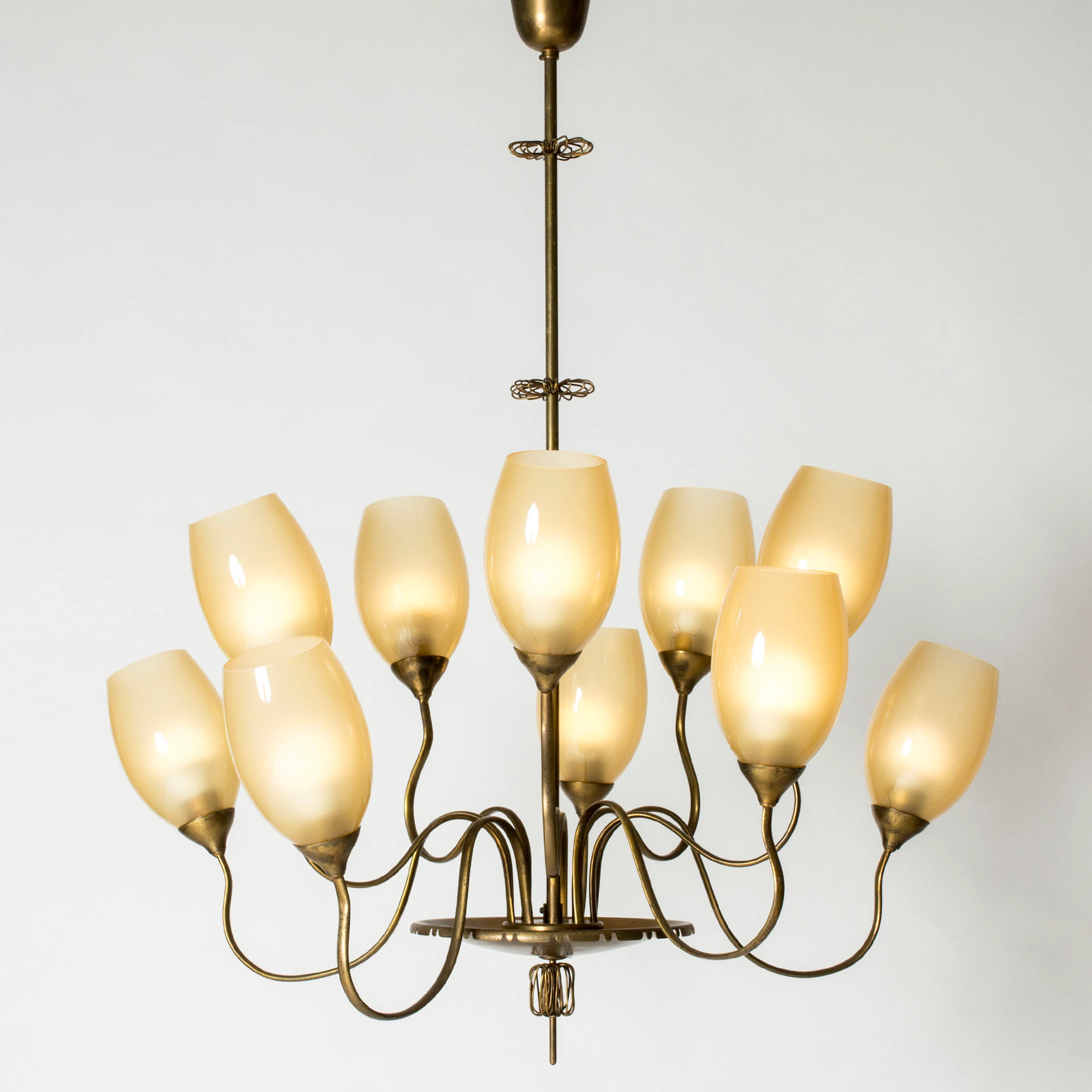 Brass chandelier by Paavo Tynell