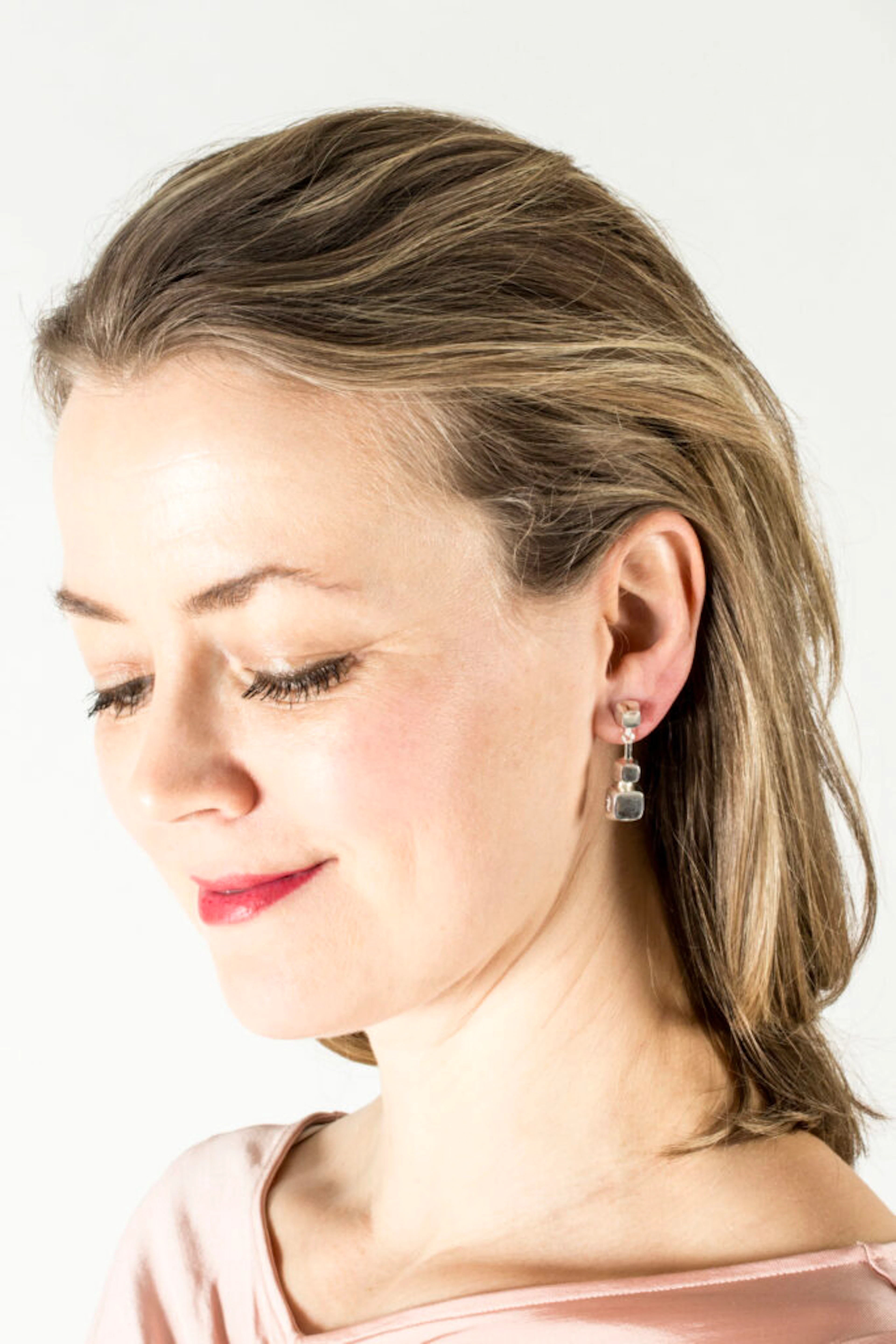 Pair of silver earrings by Sigurd Persson