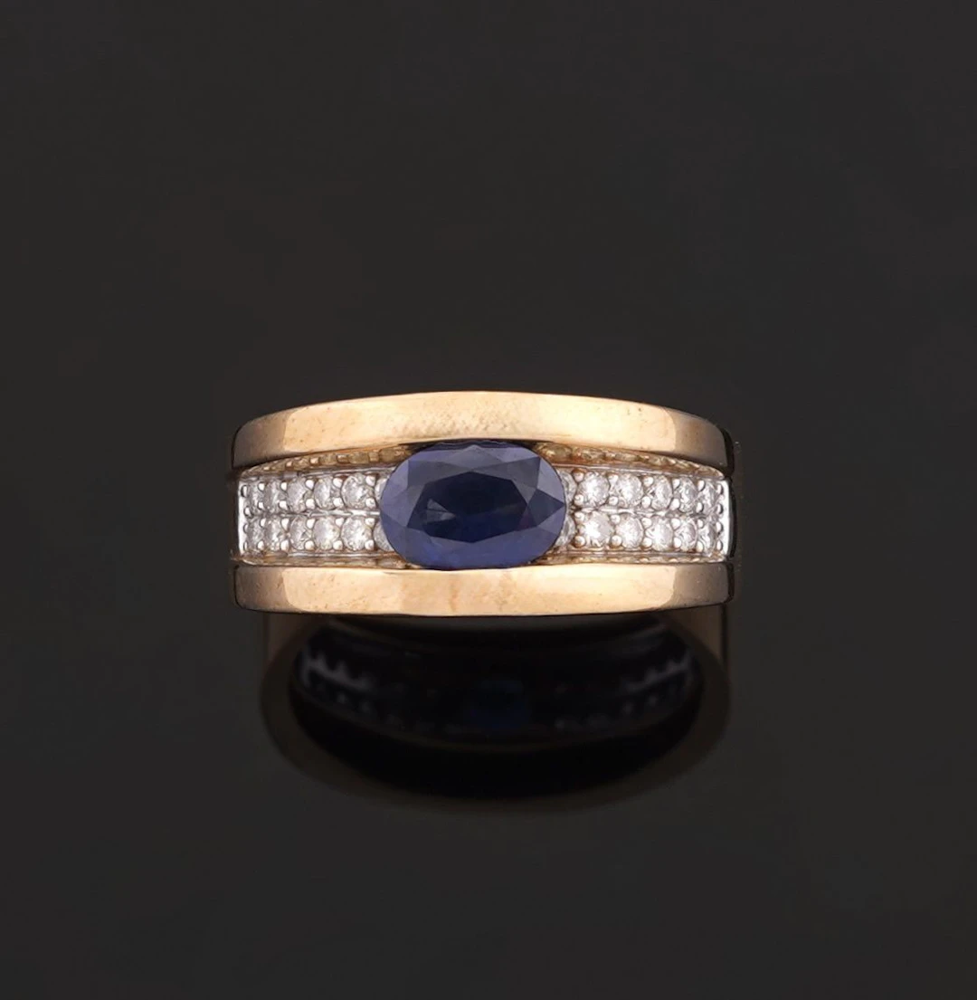 18k yellow gold (750) band ring set with an oval sapphire fl - Lot 304