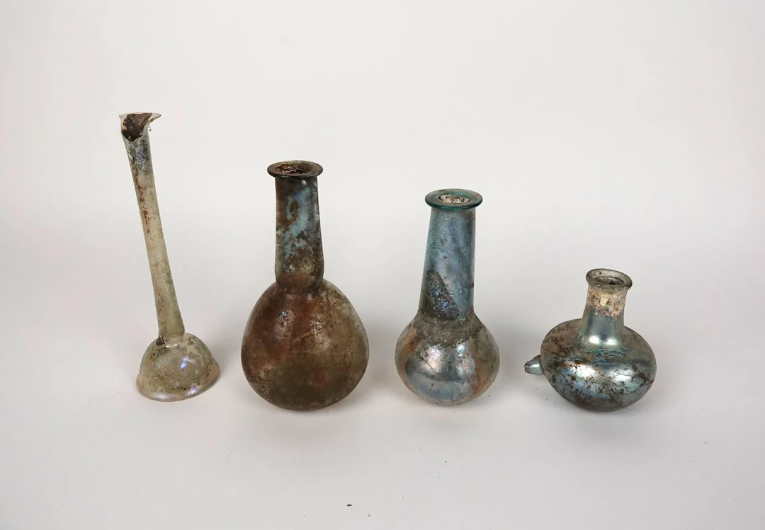 Set of four vases of various types, including a bottle with - Lot 238