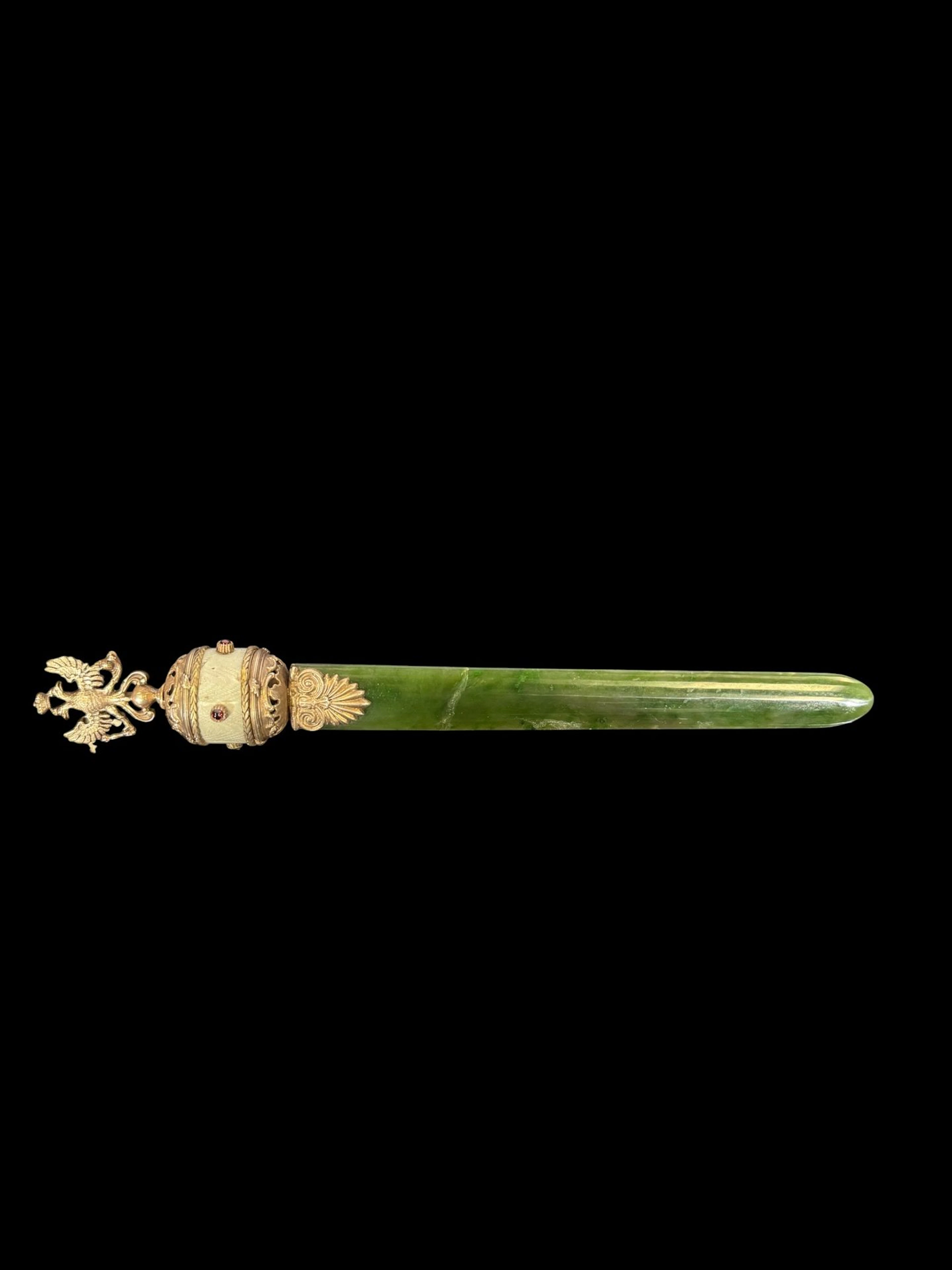 A spinach-green nephrite letter opener set in 800-th silver, - Lot 177