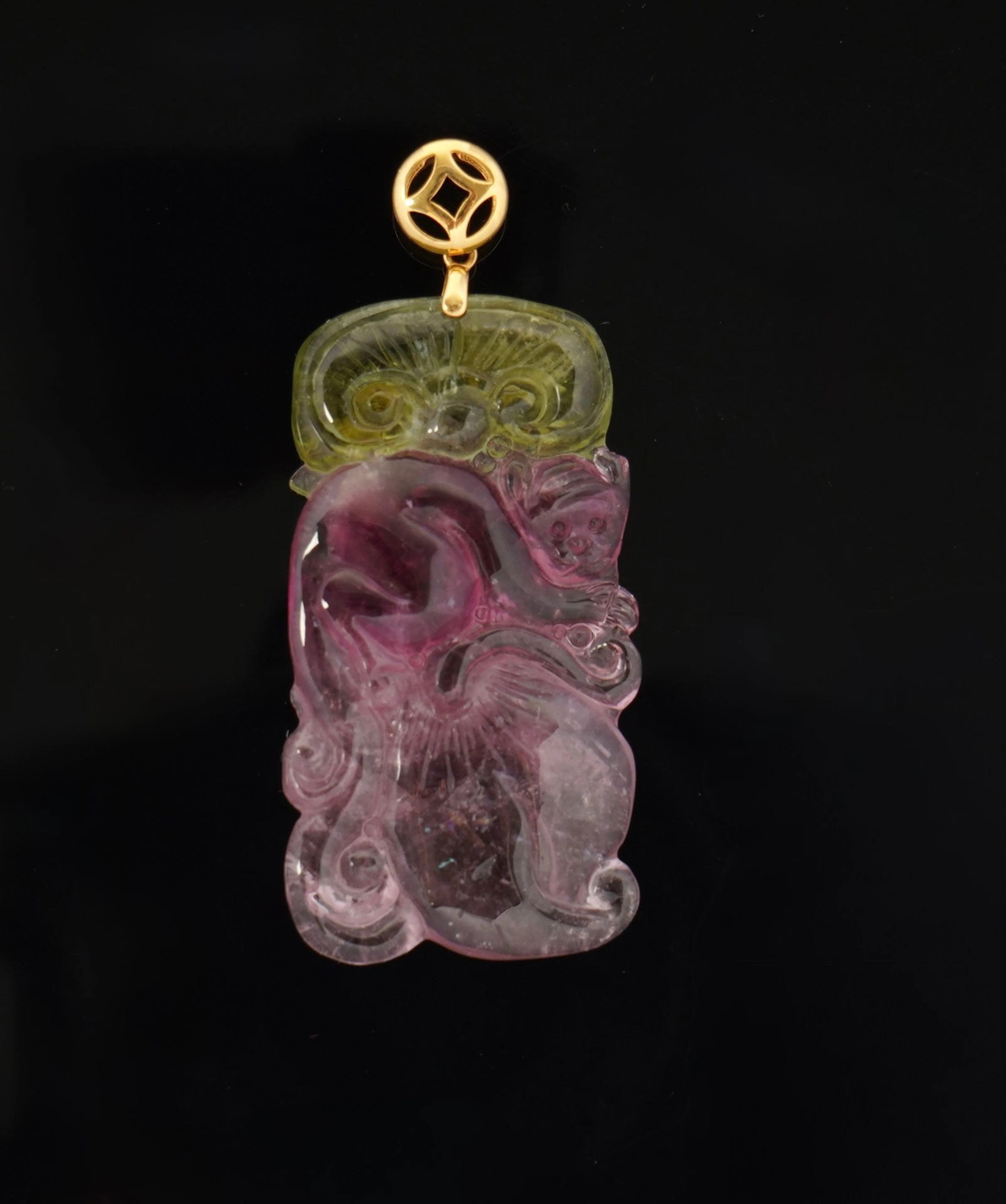A tricolor "watermelon" tourmaline pendant featuring, from t - Lot 150