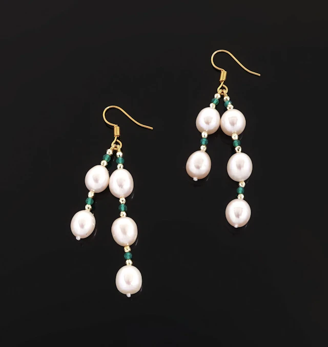 A pair of gold-tone metal earrings adorned with freshwater p - Lot 67