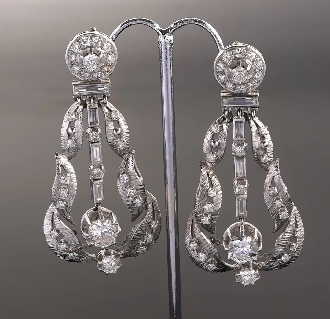A striking pair of 850-th platinum earrings, each featuring - Lot 268