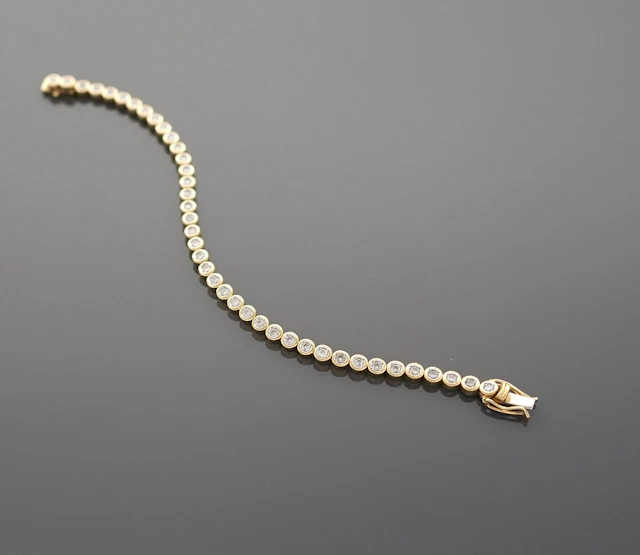 18K yellow gold tennis bracelet (750 parts per thousand) set - Lot 257