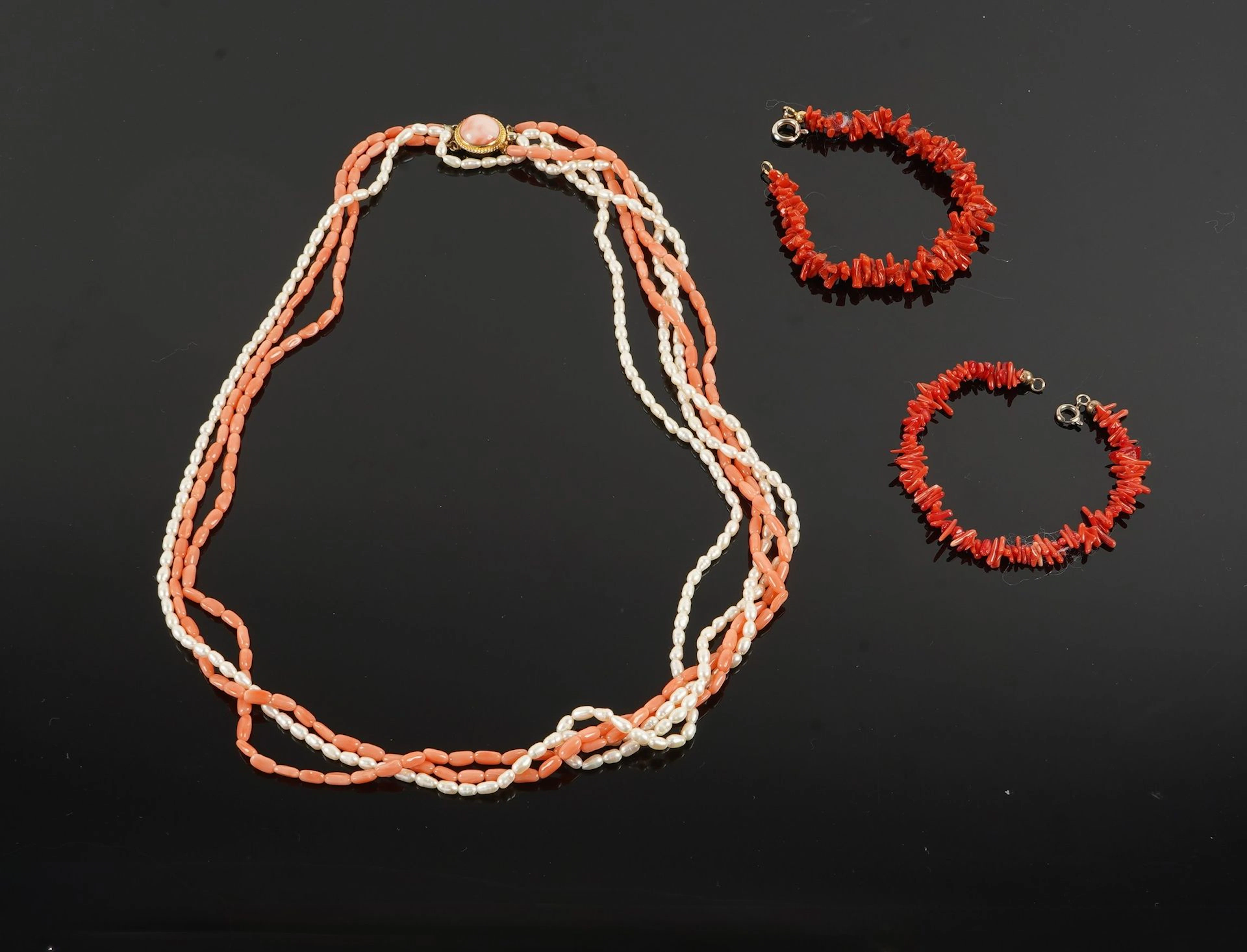 A four-strand necklace consisting of two strands of oblong c - Lot 71