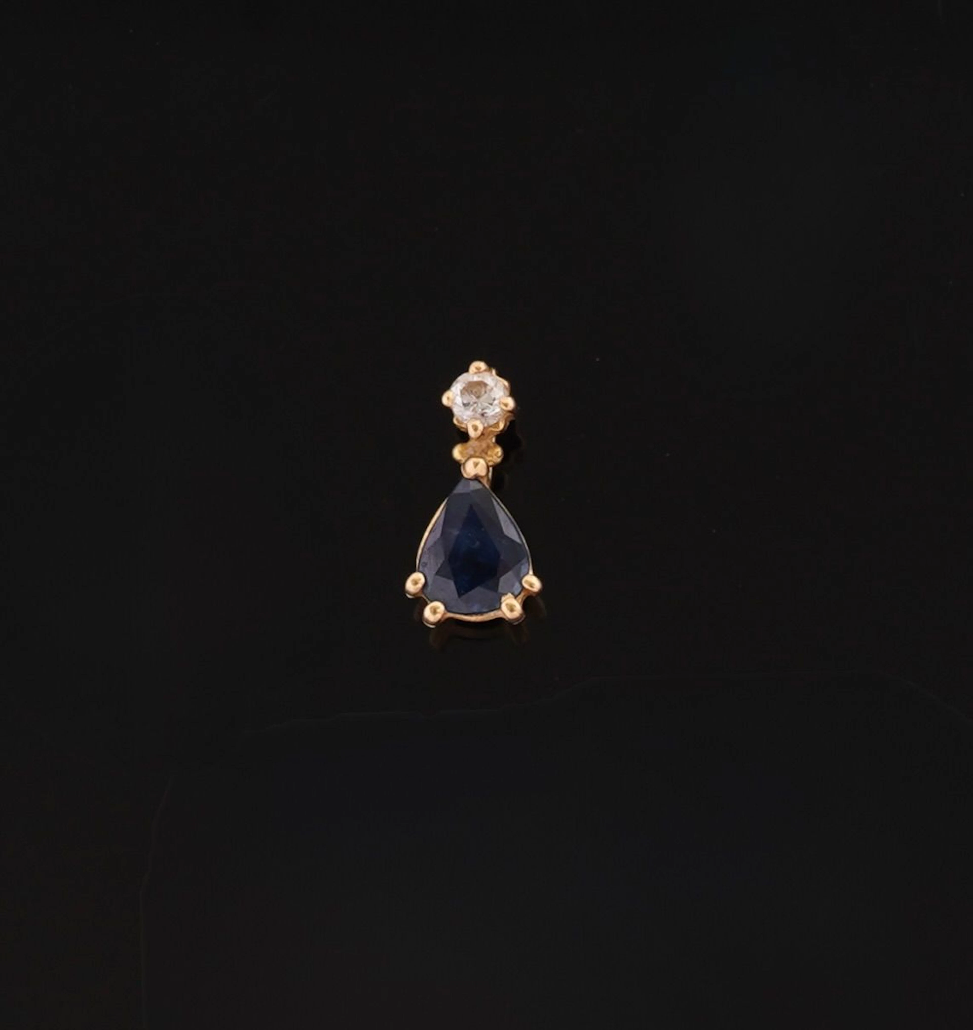 An 18k yellow gold pendant (750 parts per thousand) set with - Lot 94