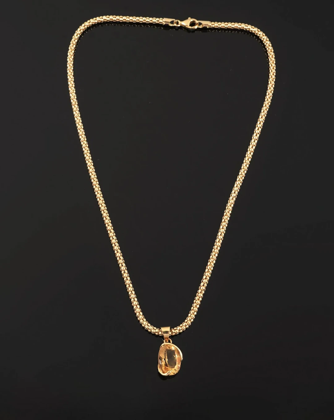 An 18k yellow gold necklace (750) with a popcorn-link chain, - Lot 178