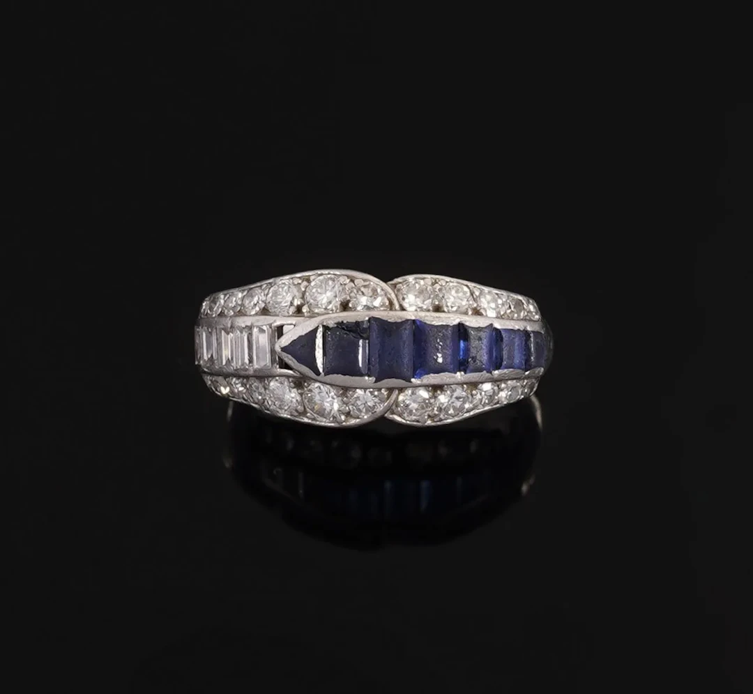 850-thousandths platinum band ring featuring an interlaced r - Lot 140
