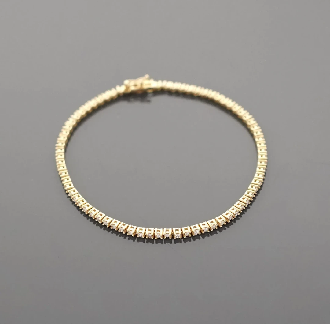 18K yellow gold tennis bracelet (750 parts per thousand) set - Lot 260