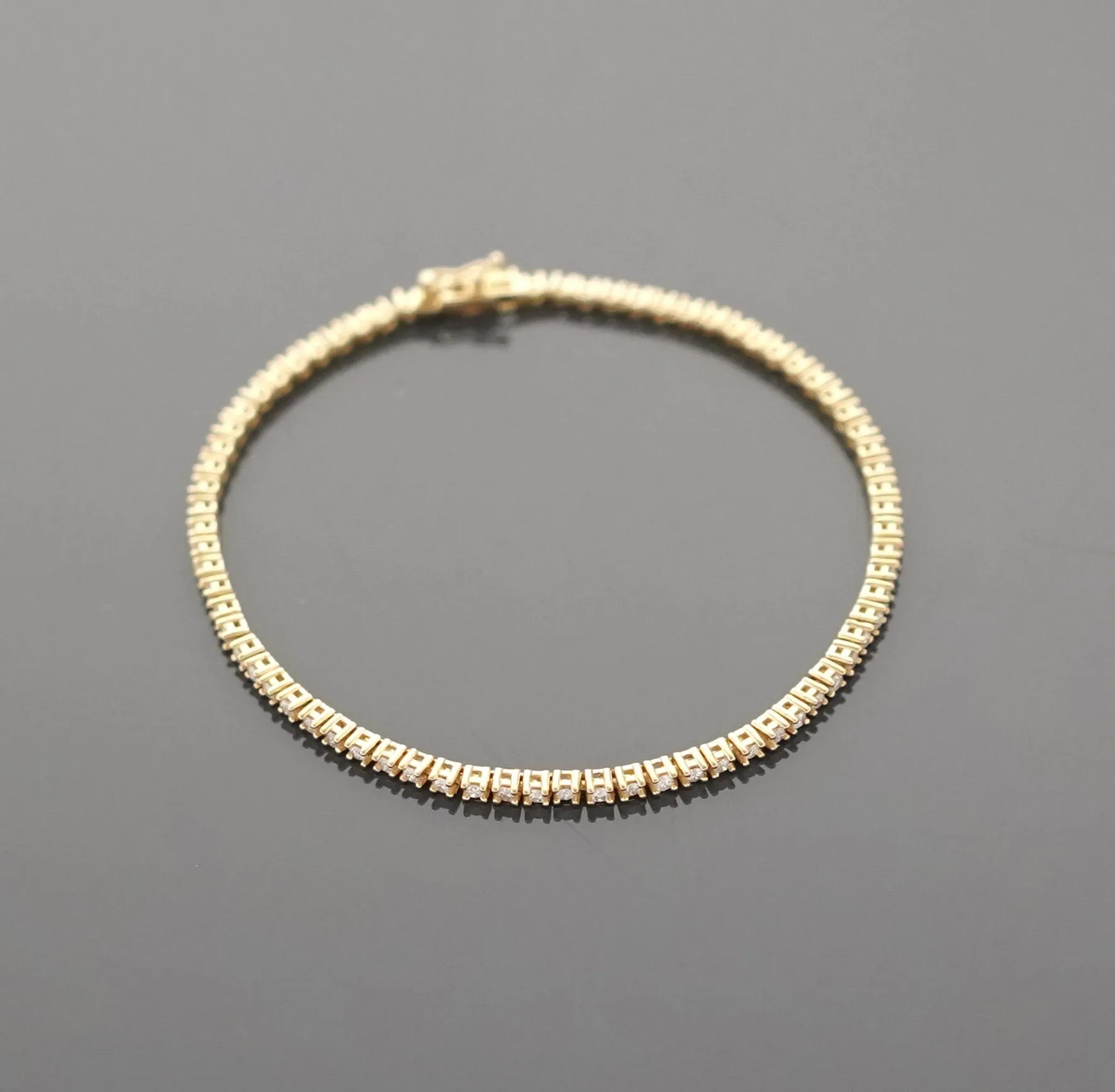 18K yellow gold tennis bracelet (750 parts per thousand) set - Lot 260