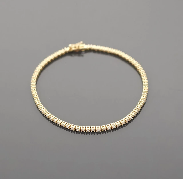 18K yellow gold tennis bracelet (750 parts per thousand) set - Lot 260