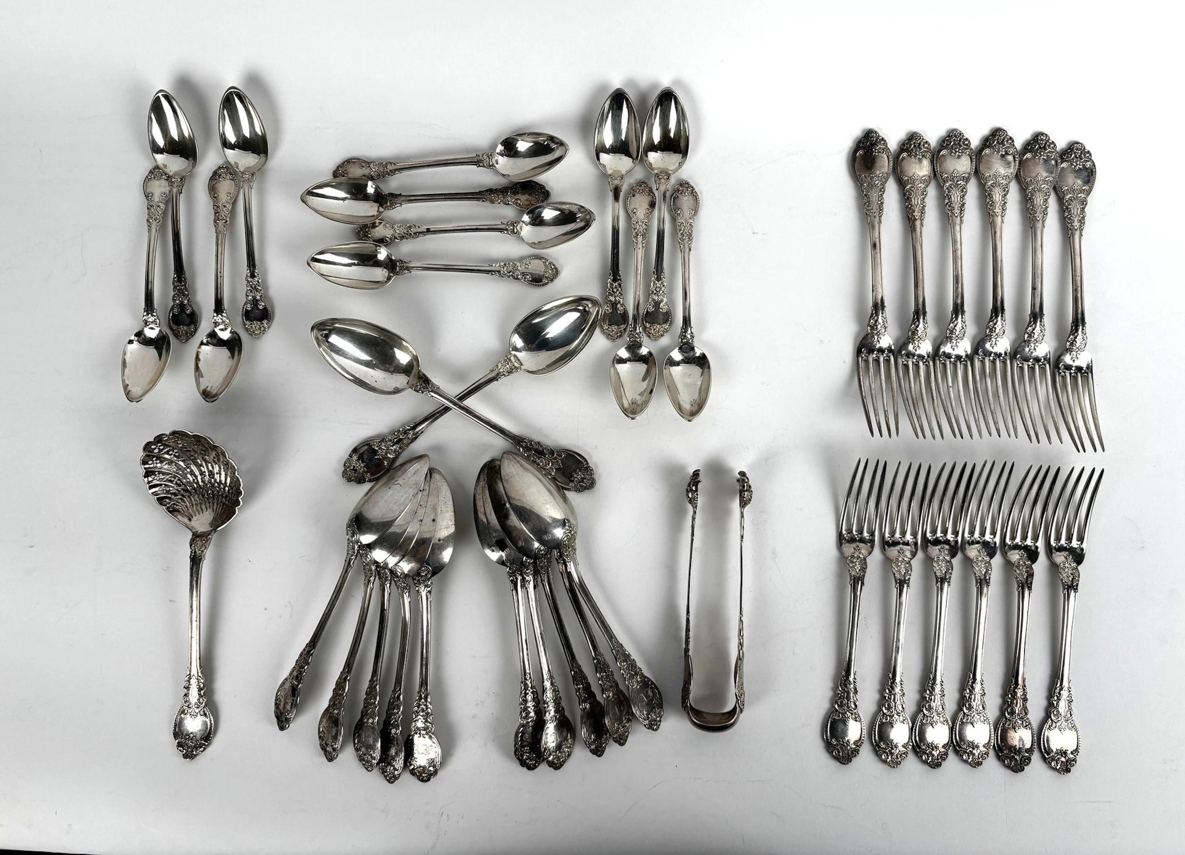A richly ornamented silver tableware set featuring a design - Lot 186