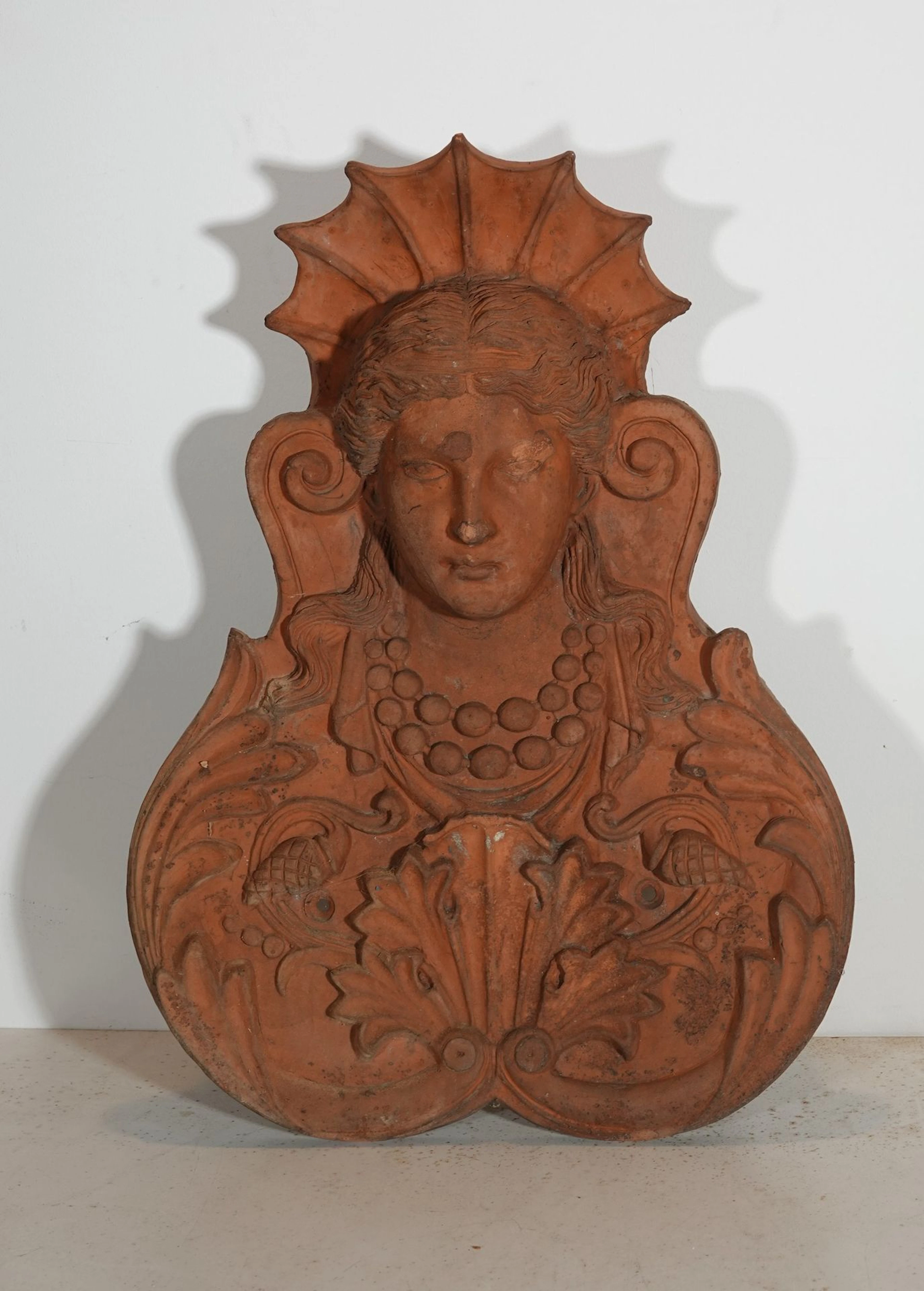 Large terracotta architectural element depicting a woman’s b - Lot 580
