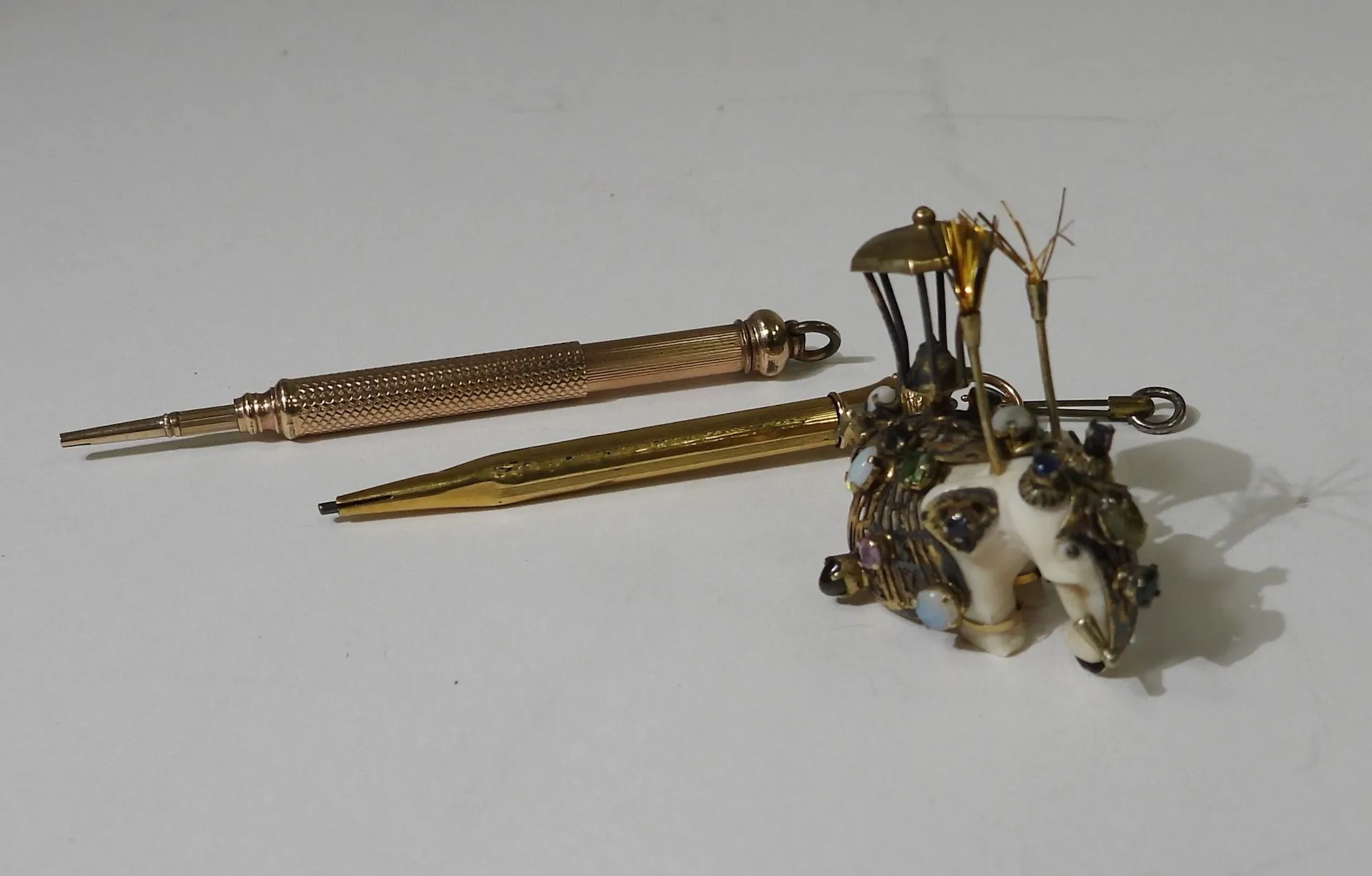 Small ivory statuette featuring an elephant mounted on an In - Lot 364