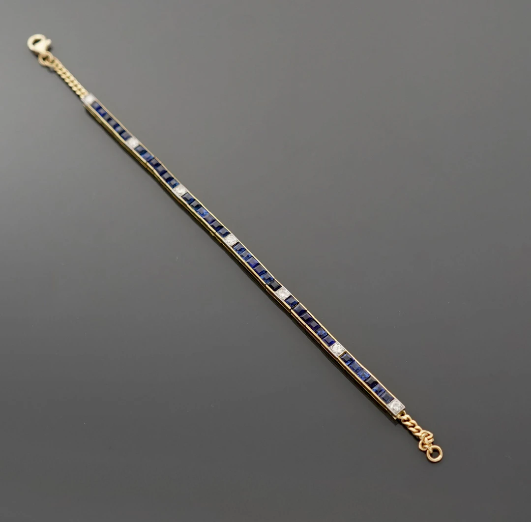 18k yellow gold (750) tennis bracelet set with calibrated sa - Lot 312