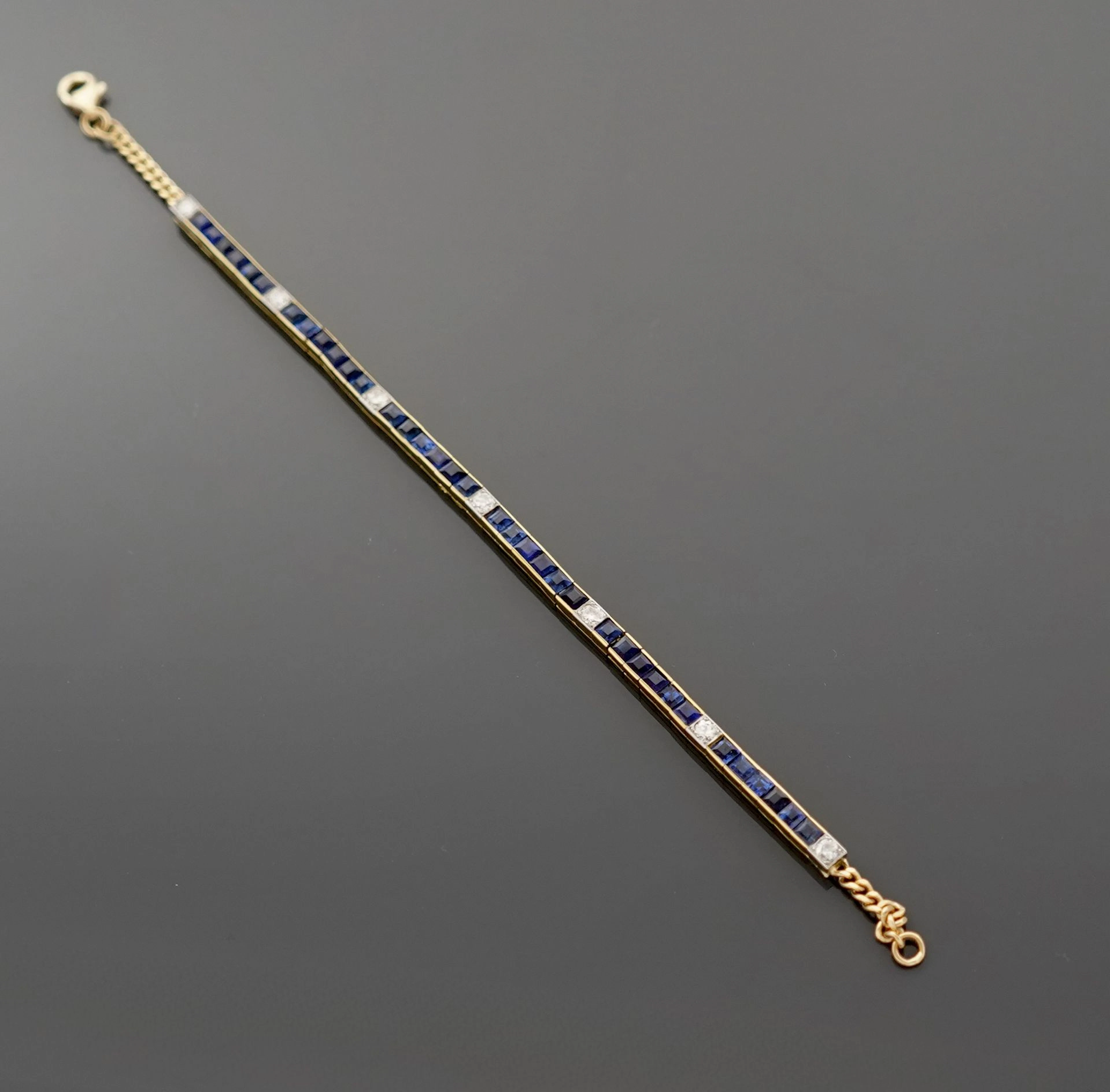 18k yellow gold (750) tennis bracelet set with calibrated sa - Lot 312