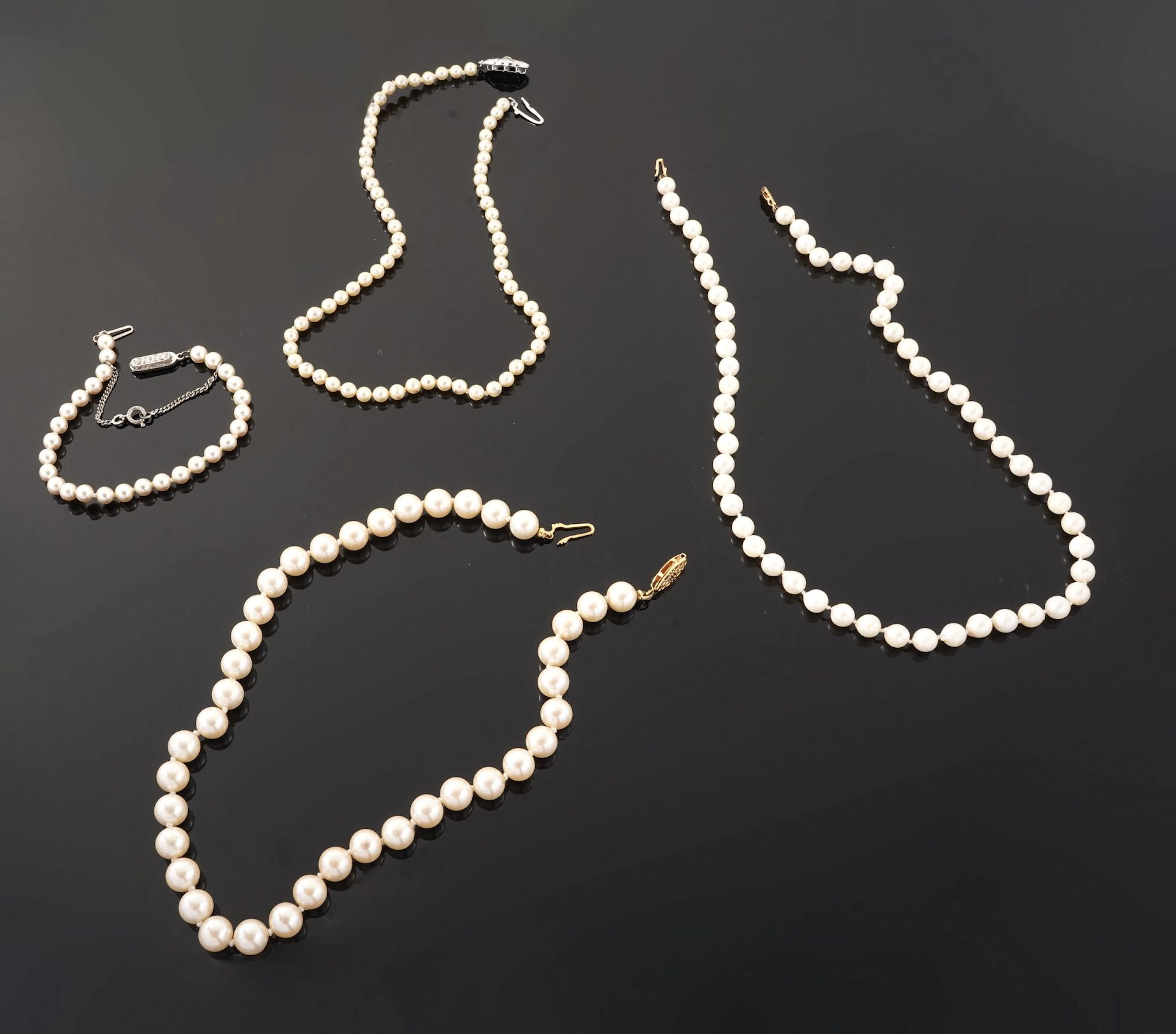 A set of three costume pearl necklaces, with gold- or silver - Lot 71