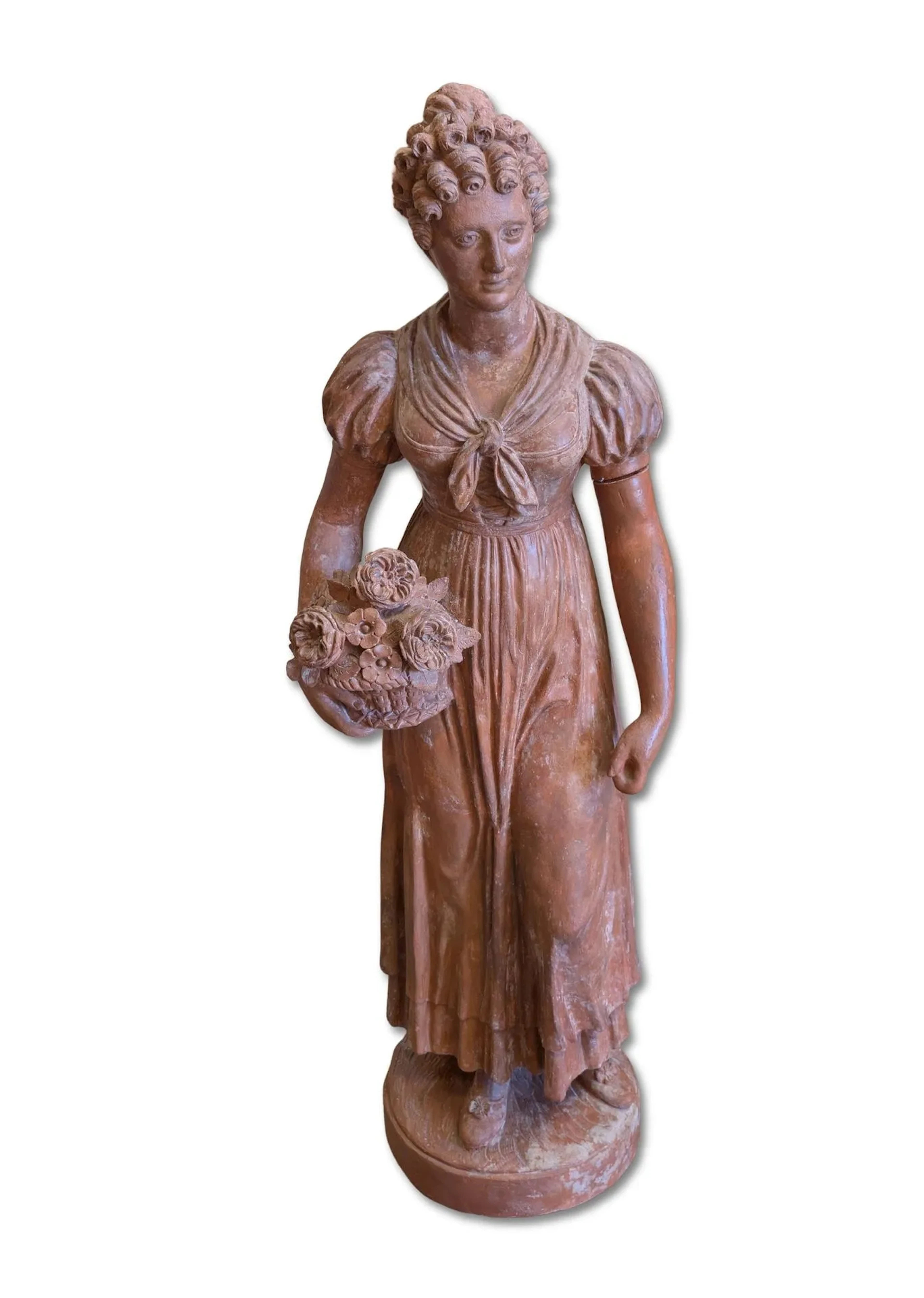Terracotta garden sculpture depicting a young woman holding - Lot 65