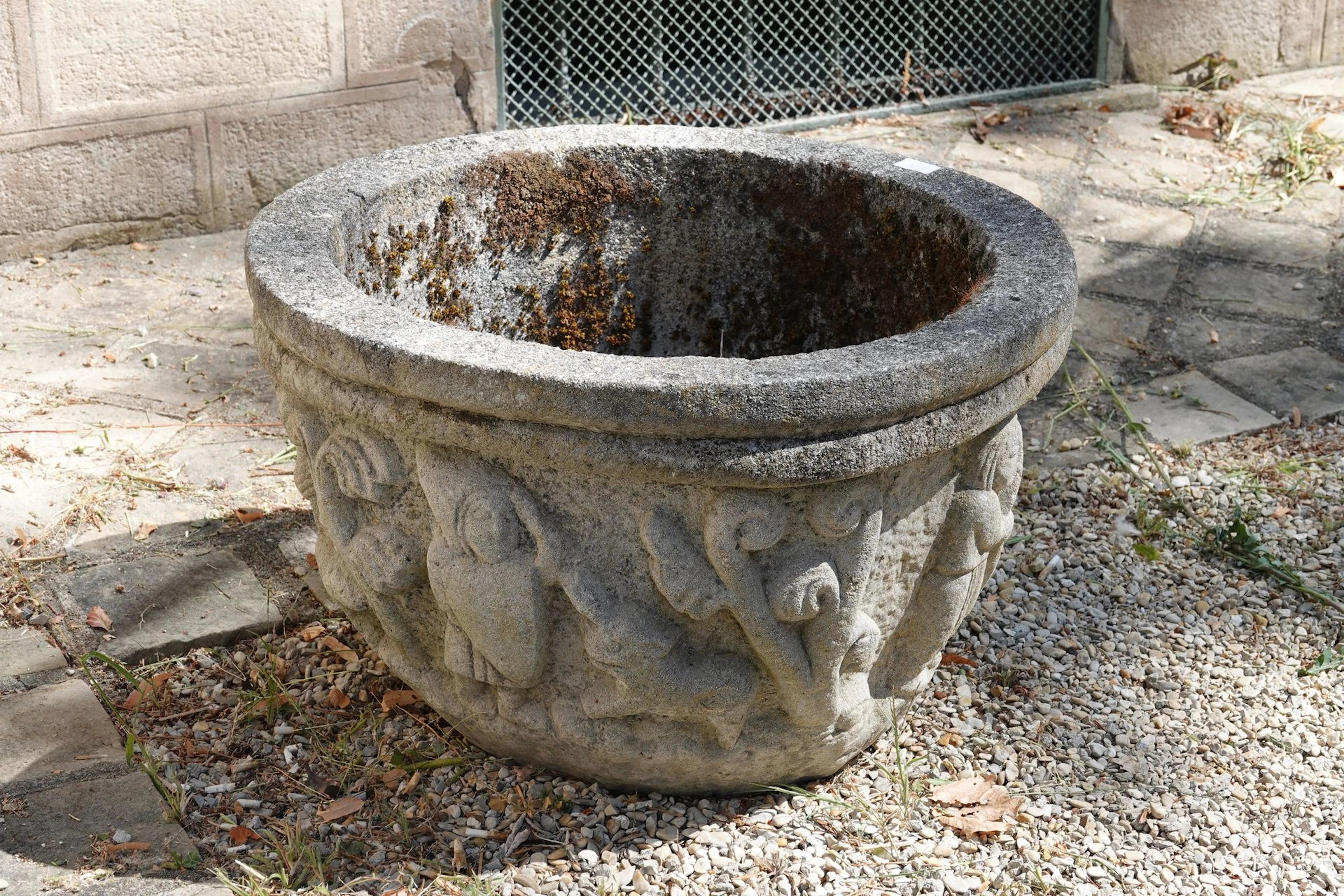 Pair of large stone mortars carved with bas-relief scenes of - Lot 576