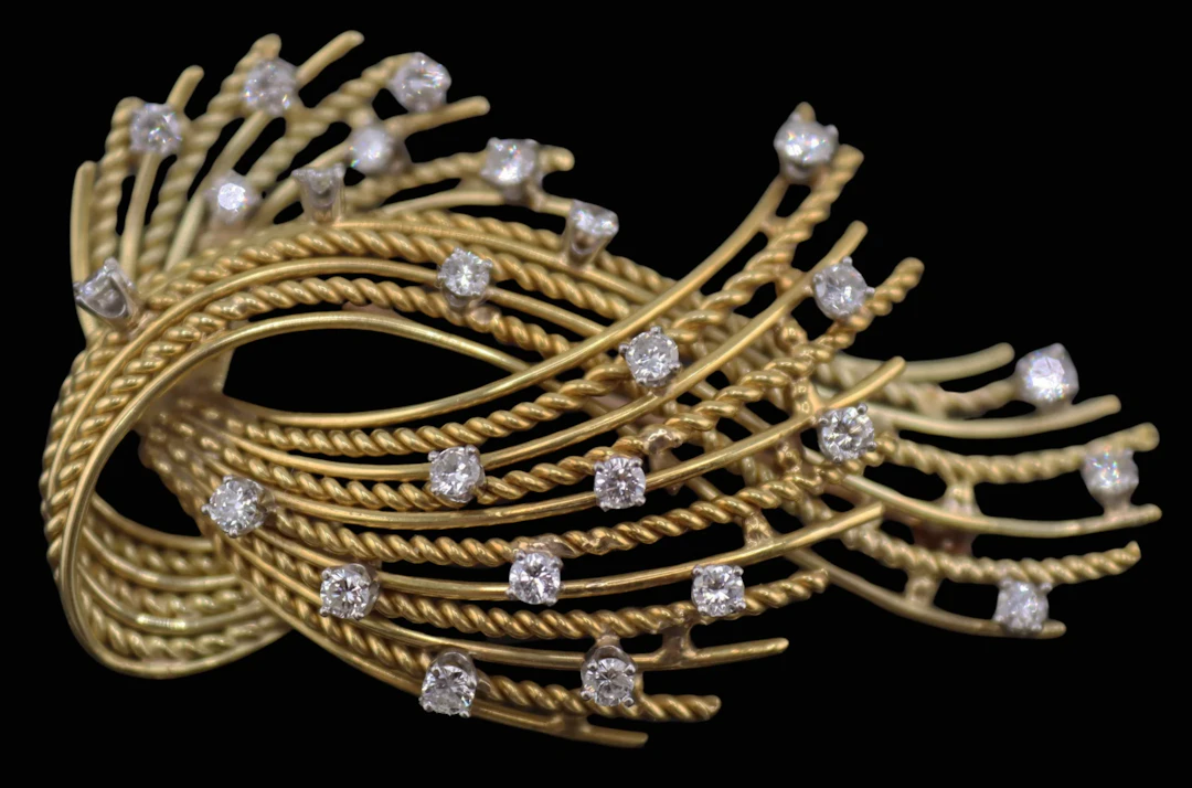 JEWELRY. 17.5kt Gold and Diamond Spray Brooch.