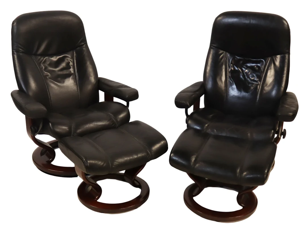 Pair of Stressless Leather Chairs and Ottomans.