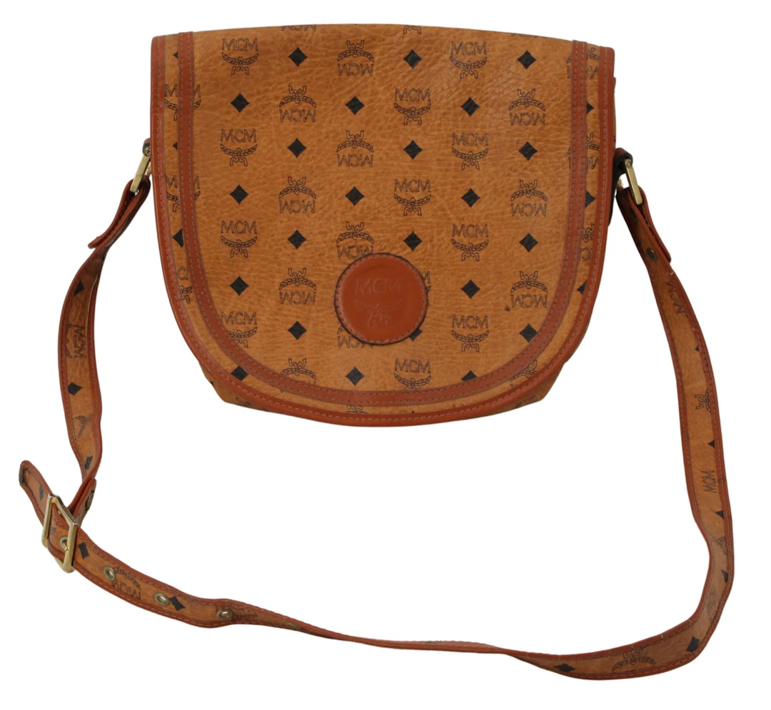 COUTURE. MCM Cognac Visetos Monogram Saddle Form