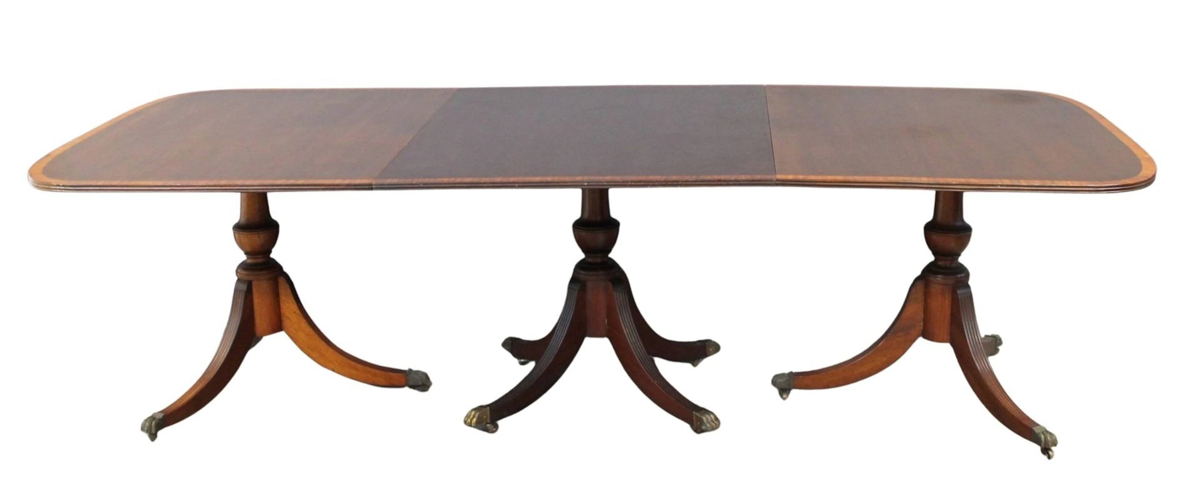 Antique Mahogany Banded Triple Pedestal Table.