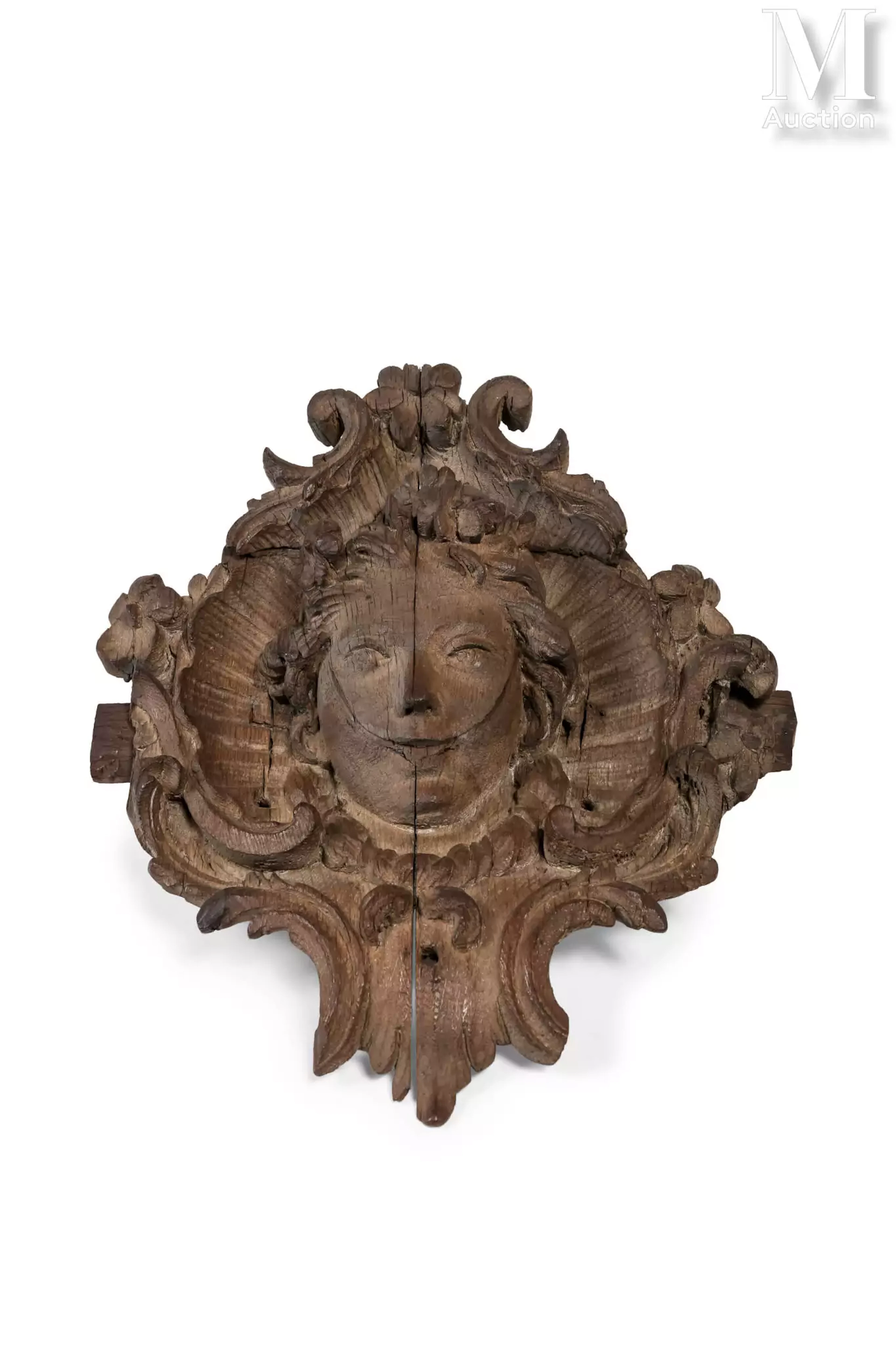 Mascaron en bois sculpté