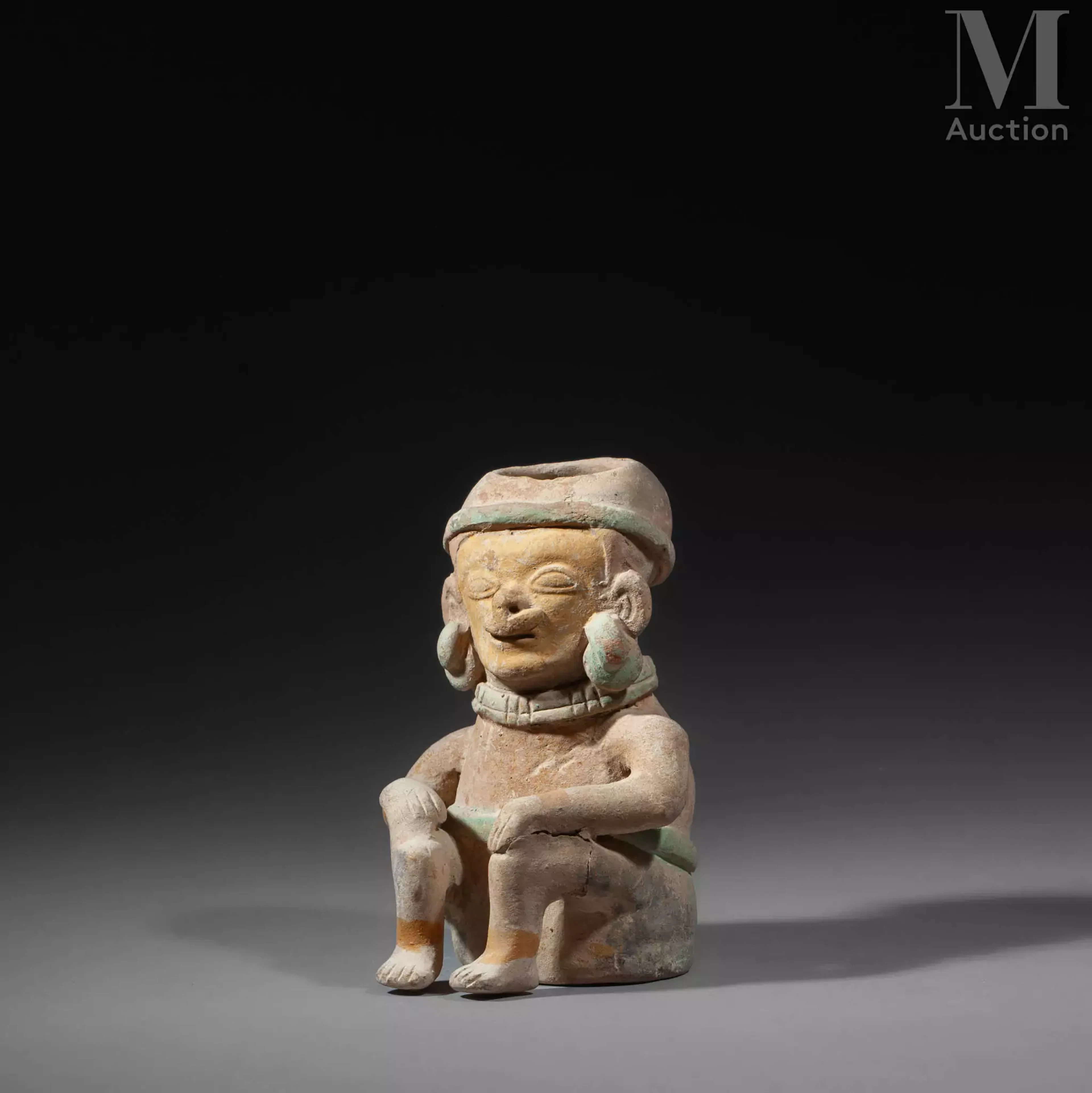 - Réceptacle anthropomorphe au seigneur assis.