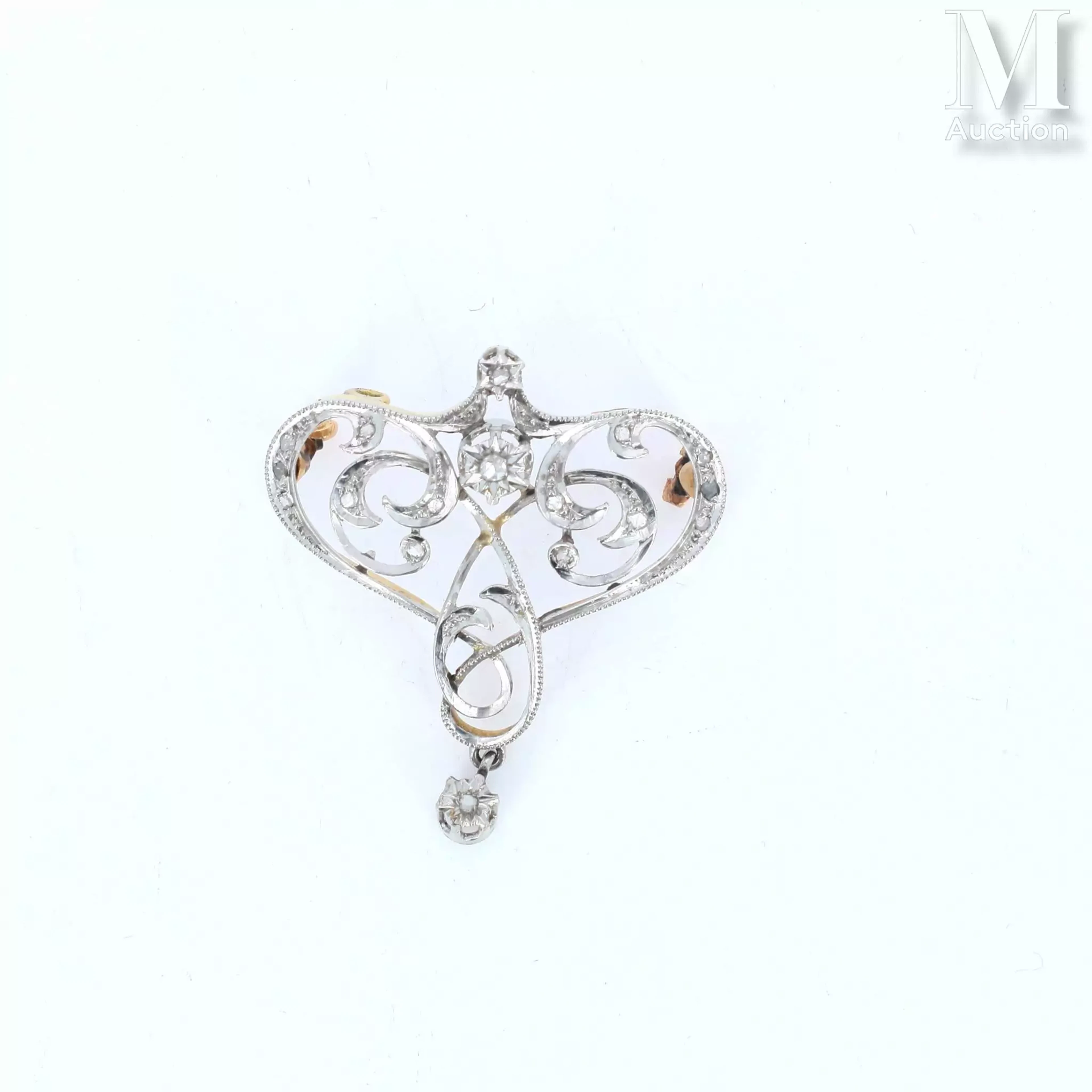 Broche pendentif volute