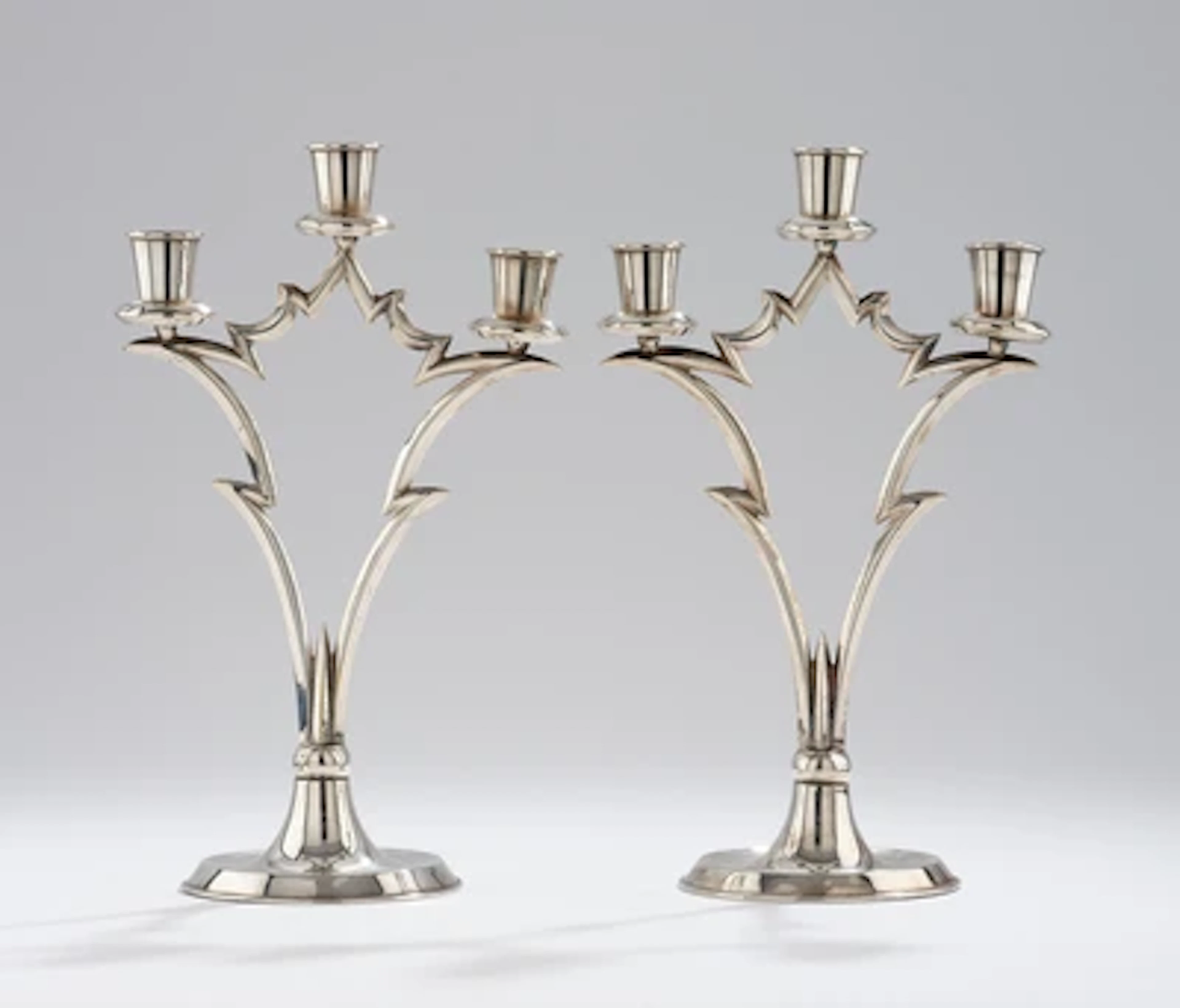 A pair of three-light candelabra, in the style of Dagobert Peche