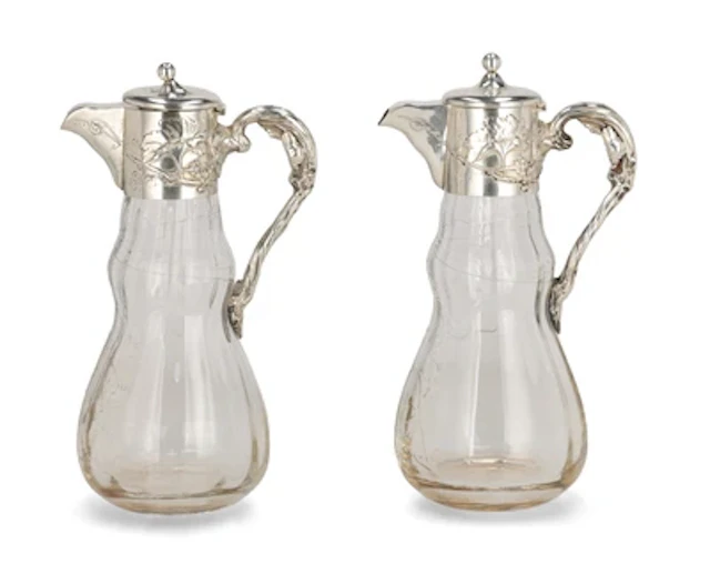 Two handled carafes with silver mounts, decoration with vine tendrils