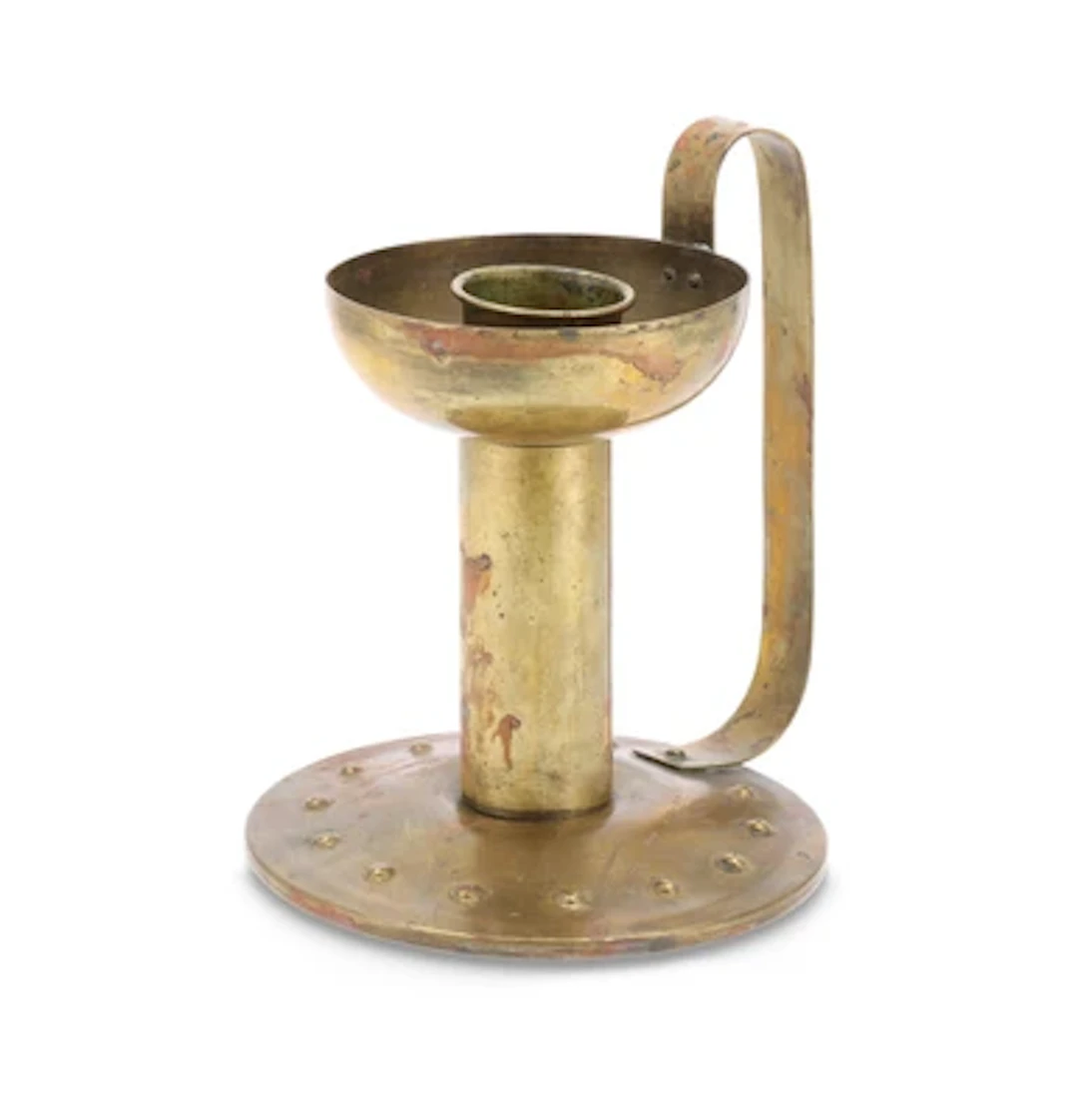 A candlestick in the Arts & Crafts style, c. 1900/15