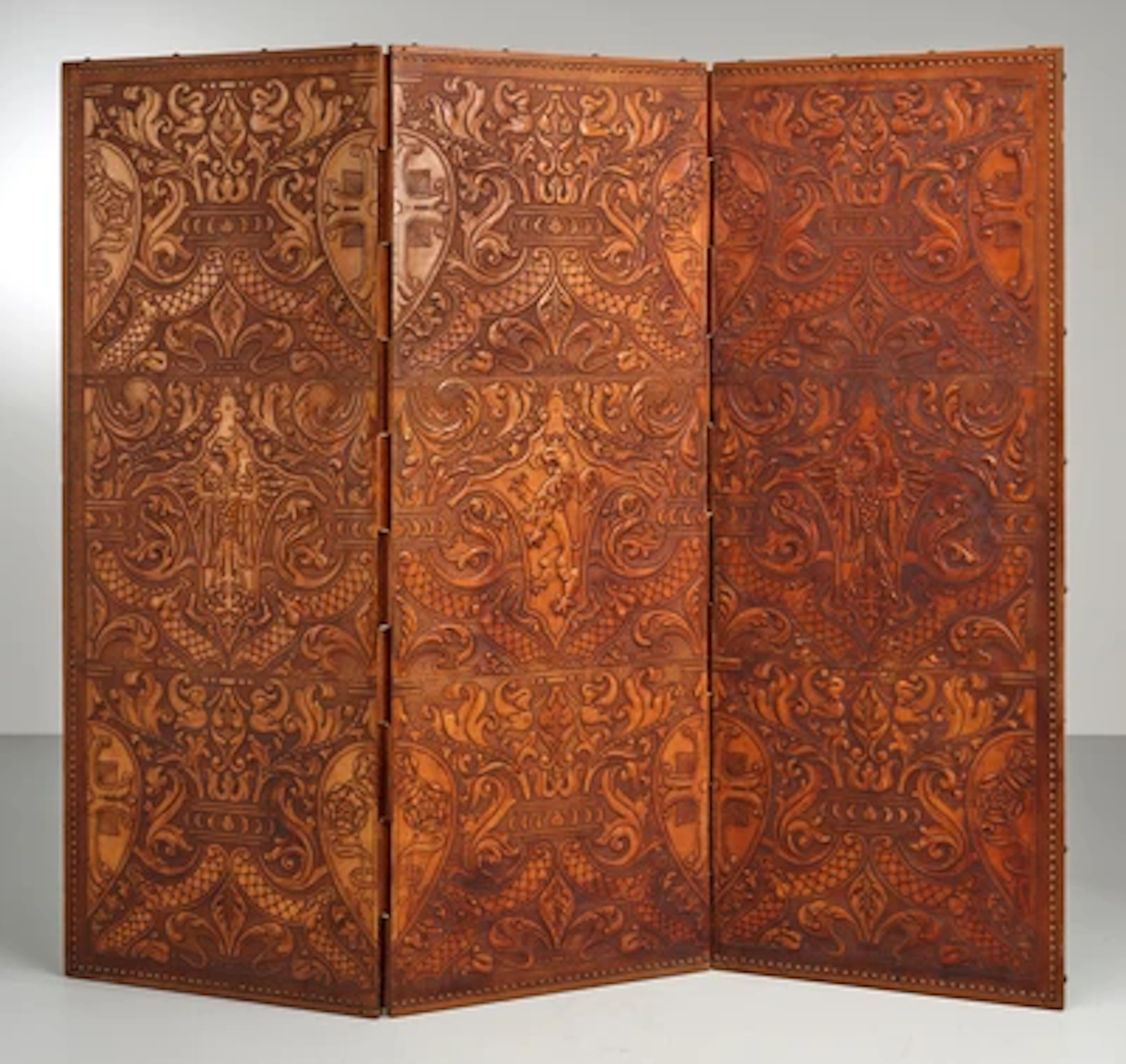 A divider with various leather ornaments, c. 1930/50