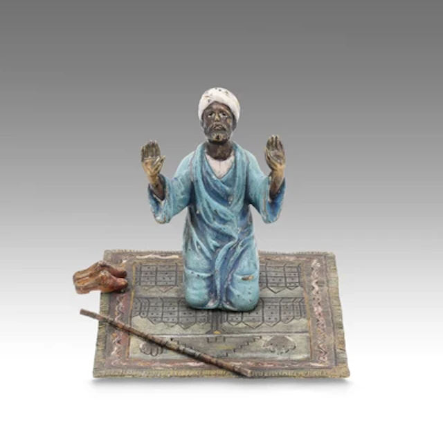 F. X. Bergmann, a man praying on an Oriental carpet, Vienna, c. 1900