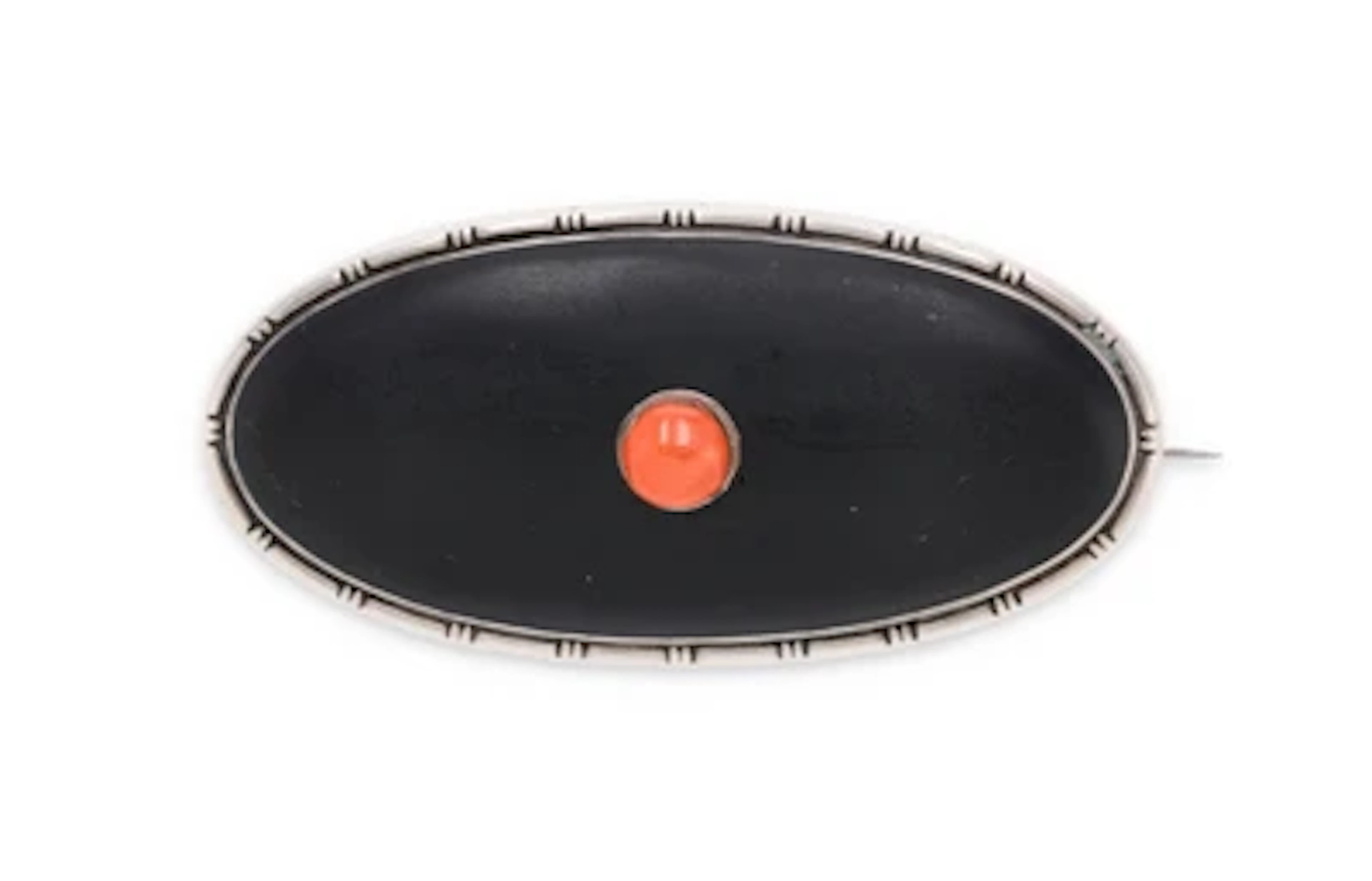 A silver brooch with black enamelling and coral, Hermann Bauer, Schwäbisch