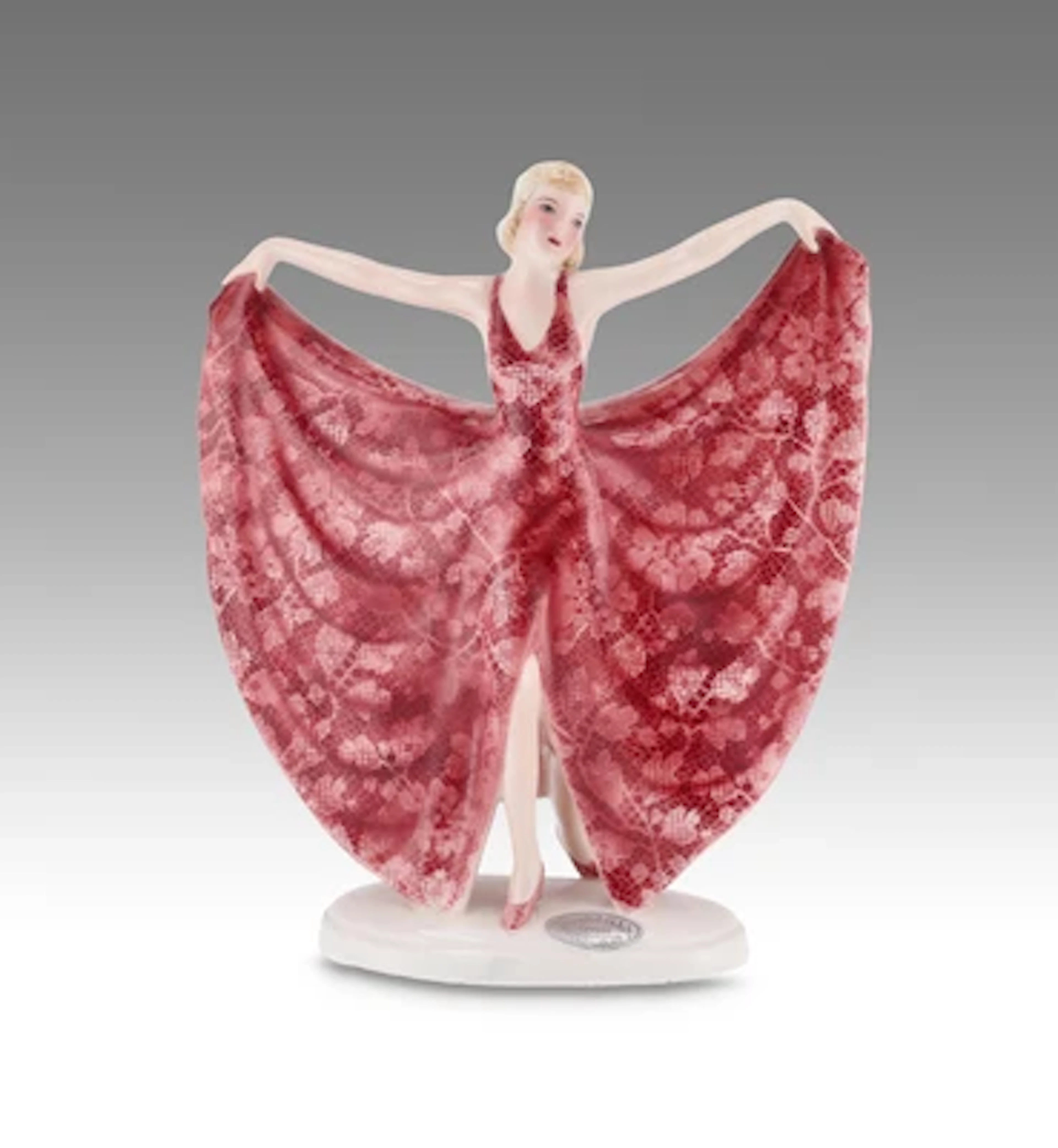 Stephan Dakon, a standing dancer (holding her dress apart like butterfly
