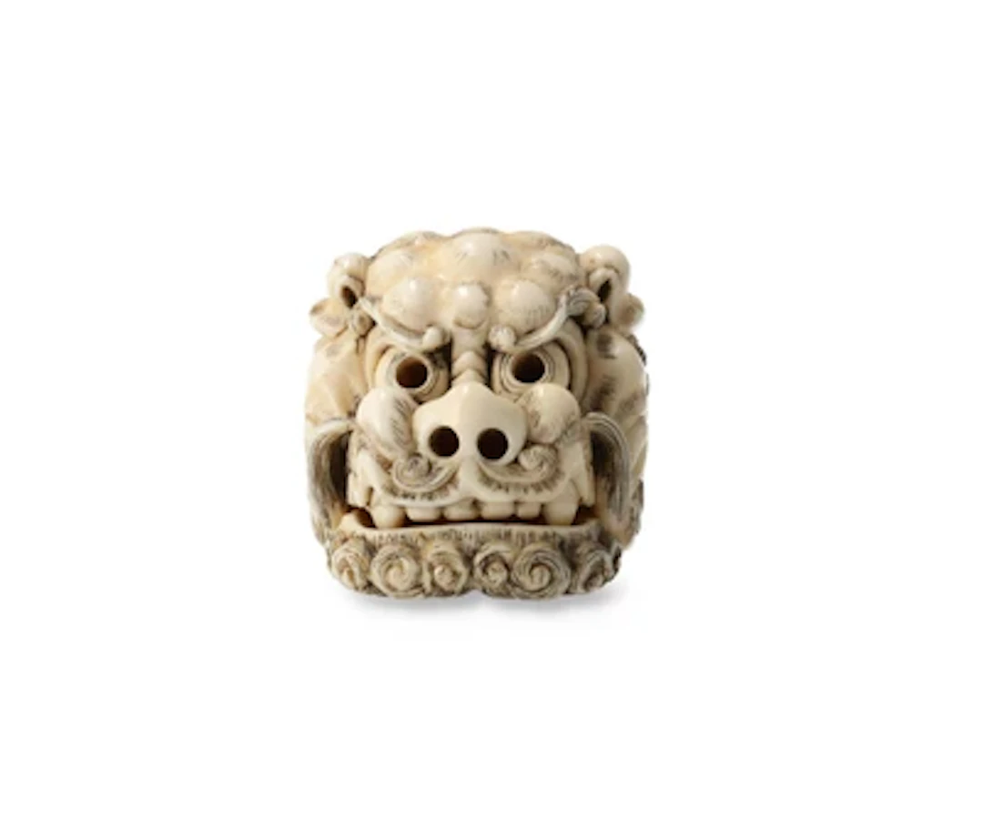 Netsuke eines Shishikopfes, Japan, 19. Jh., signiert Tomotada