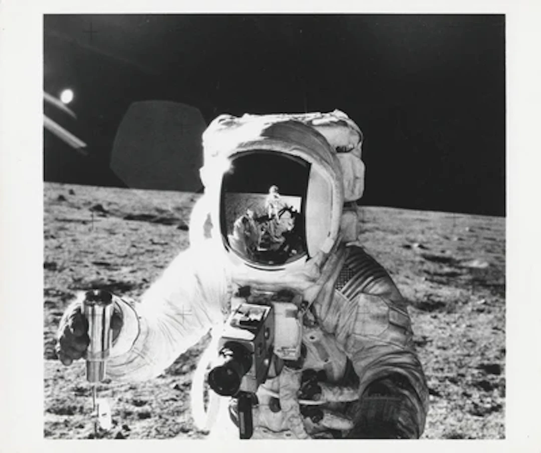 APOLLO 12 - Alan Bean with the Photographer Reflected in His Visor