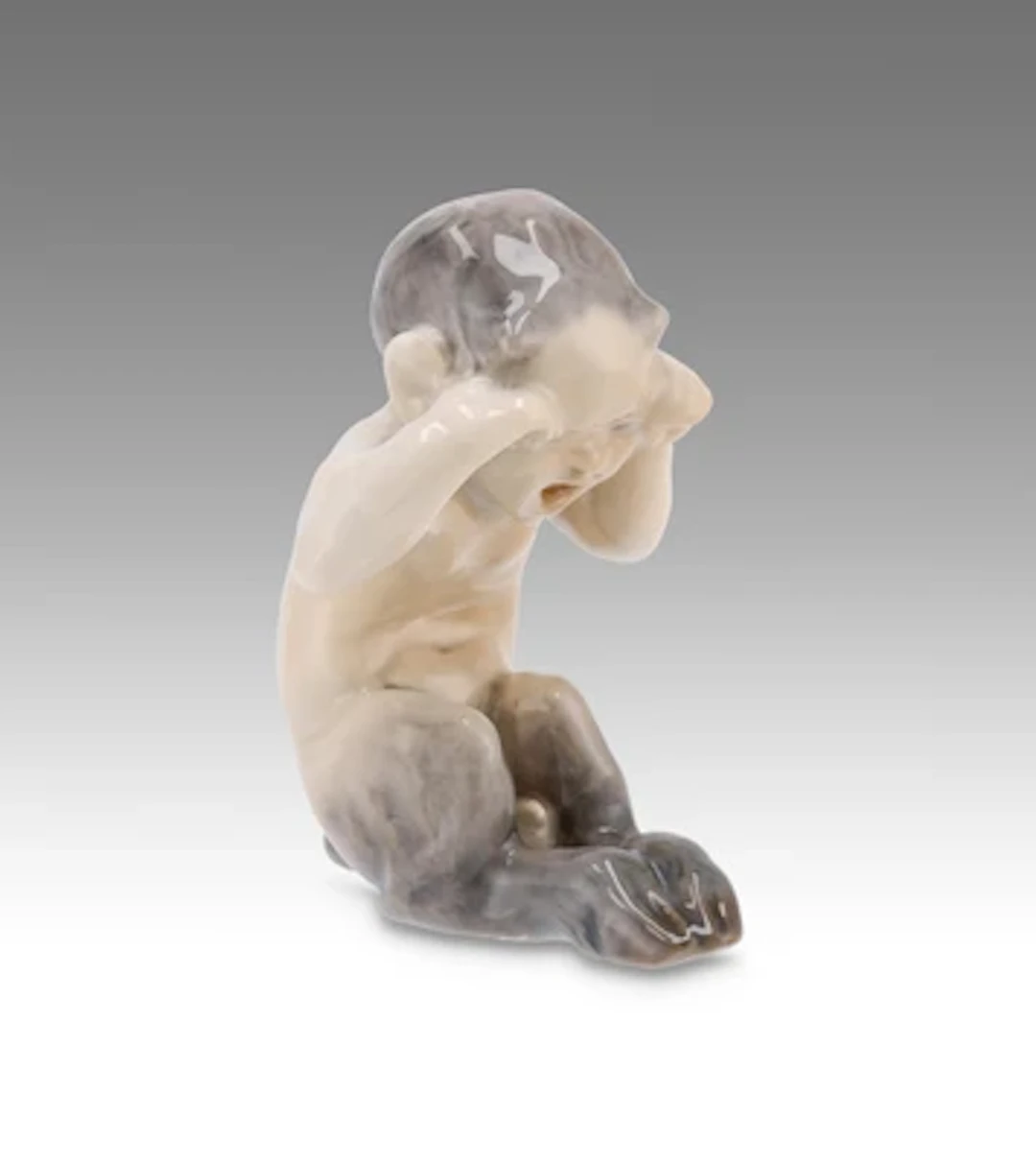 Knud Kyhn, a weeping faun, model number 1061, Royal Copenhagen, c. 1923