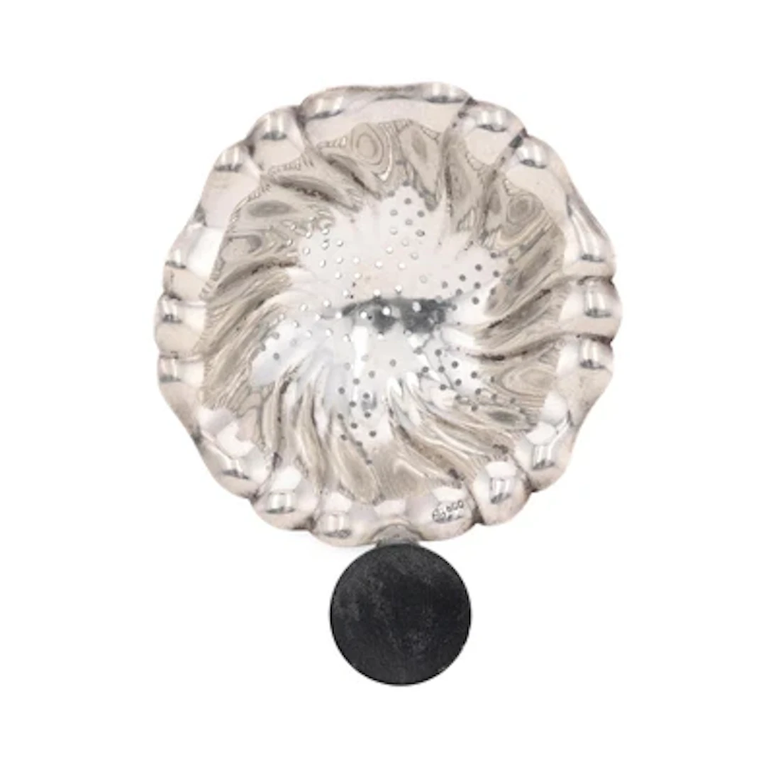 A silver tea strainer with wooden handle, Alexander Sturm, Vienna