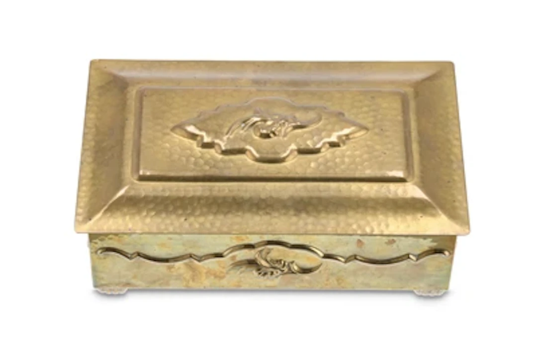 A brass lidded box with geometric and vegetal decoration, c. 1915