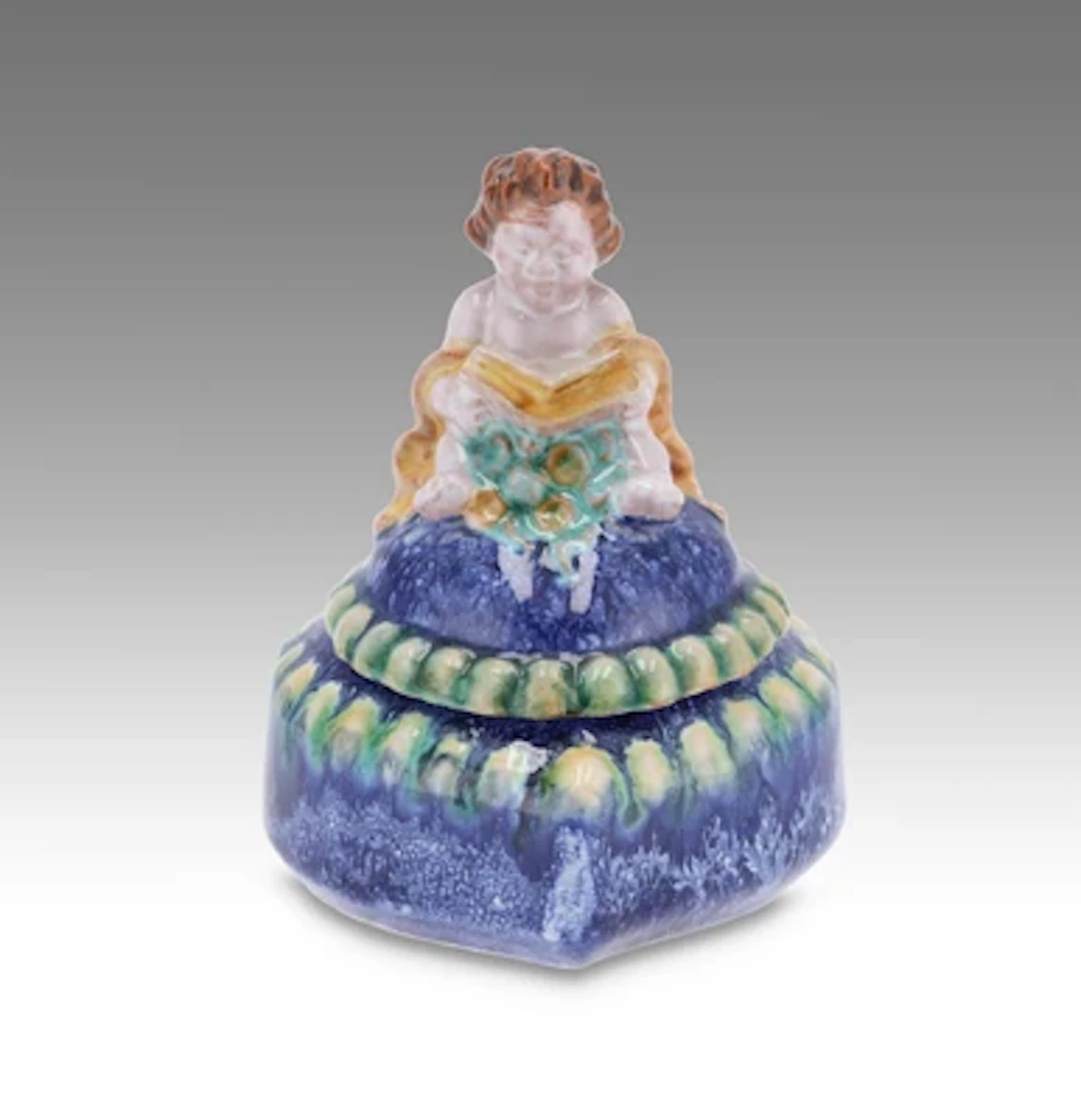 Leo Miller, a heart-shaped lidded box with reading putto, model number