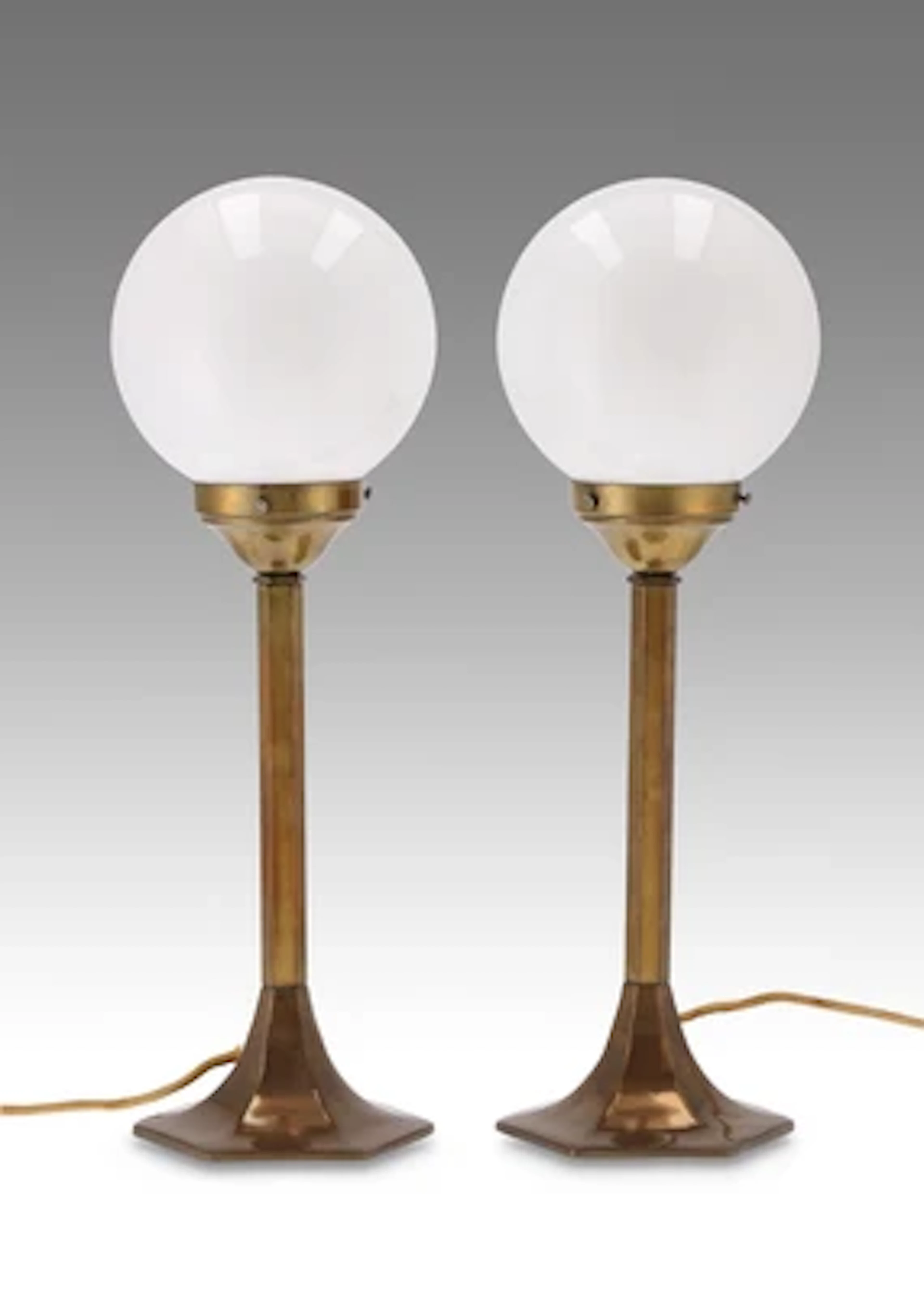A pair of brass table lamps, in the manner of Josef Hoffmann, designed