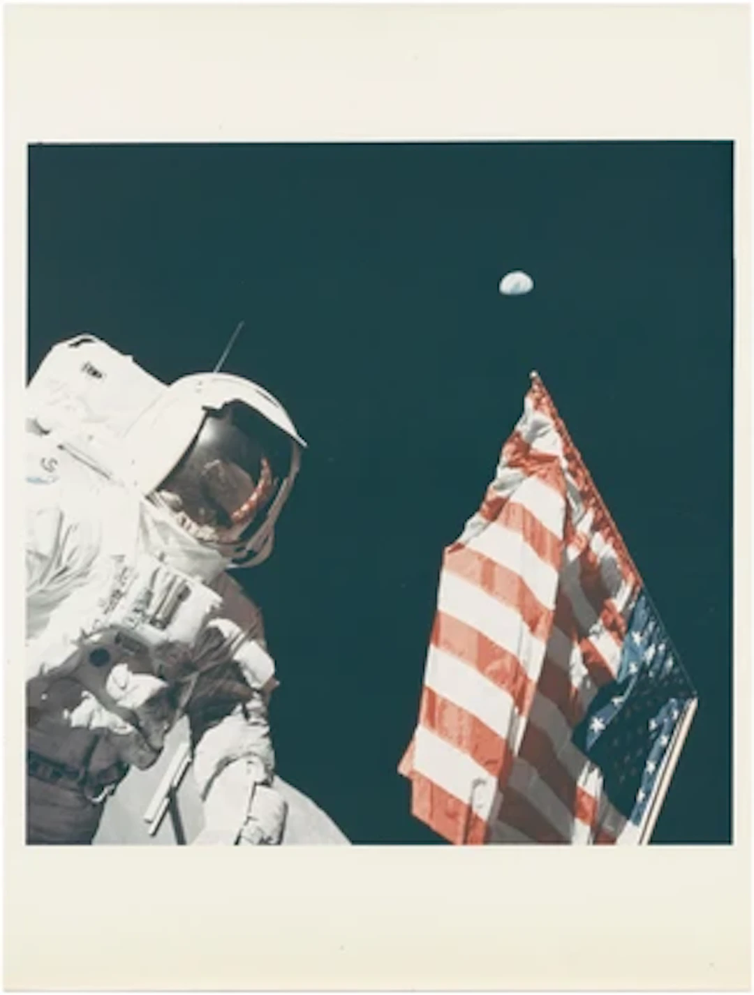 APOLLO 17 - Harrison Schmitt, the Earth an the U. S. Flag