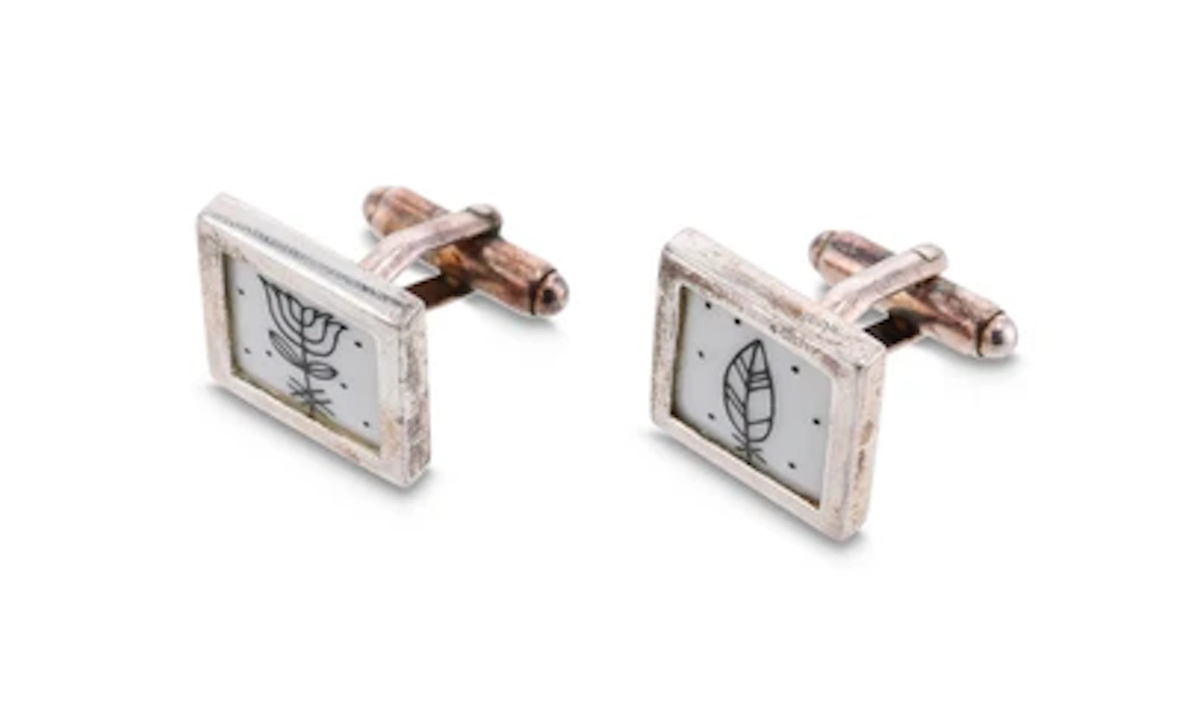 Two cufflinks with "Mythos" decoration and sterling silver mounts