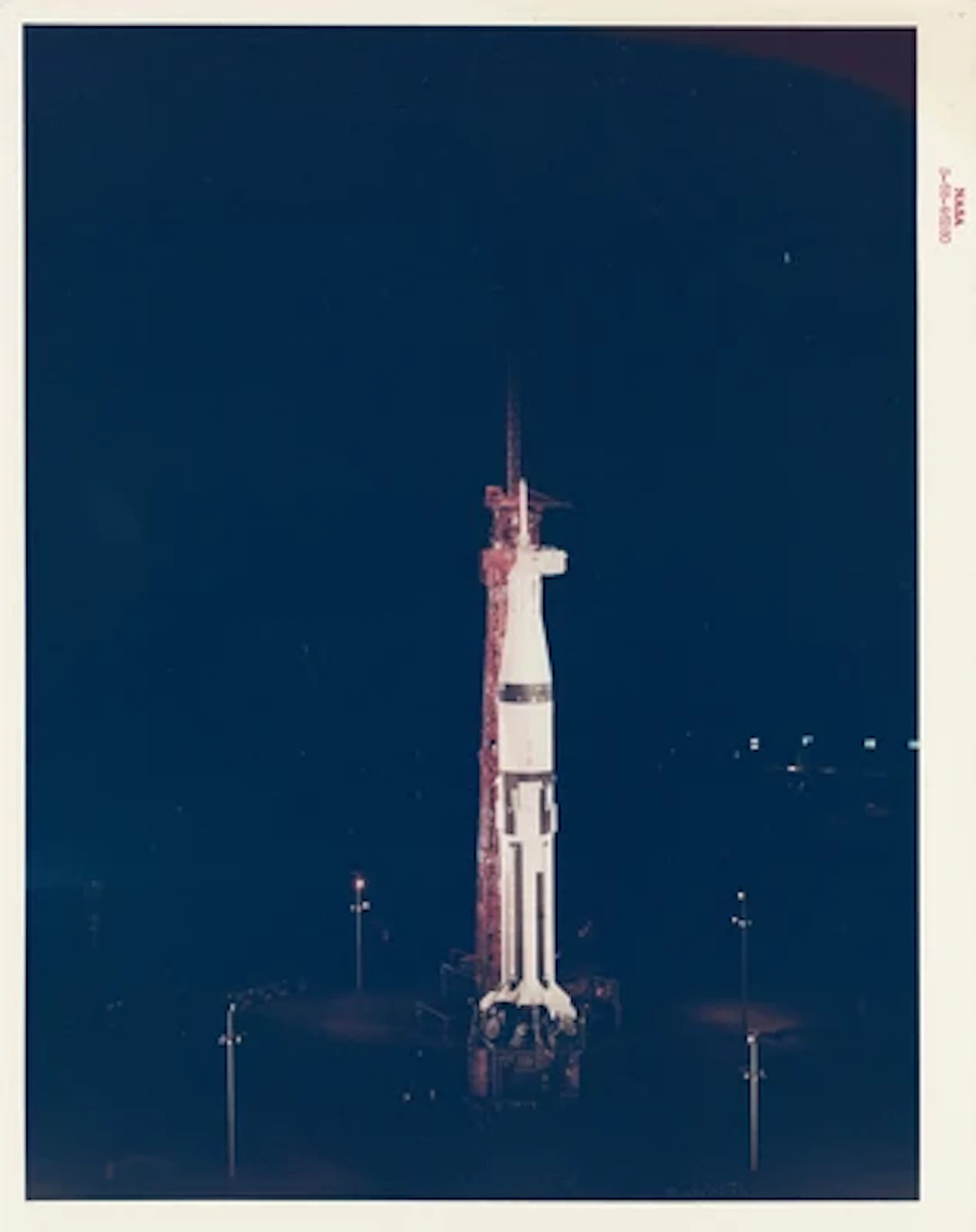 APOLLO 7 - The First Crewed Apollo Spacecraft Awaits Launch at Night