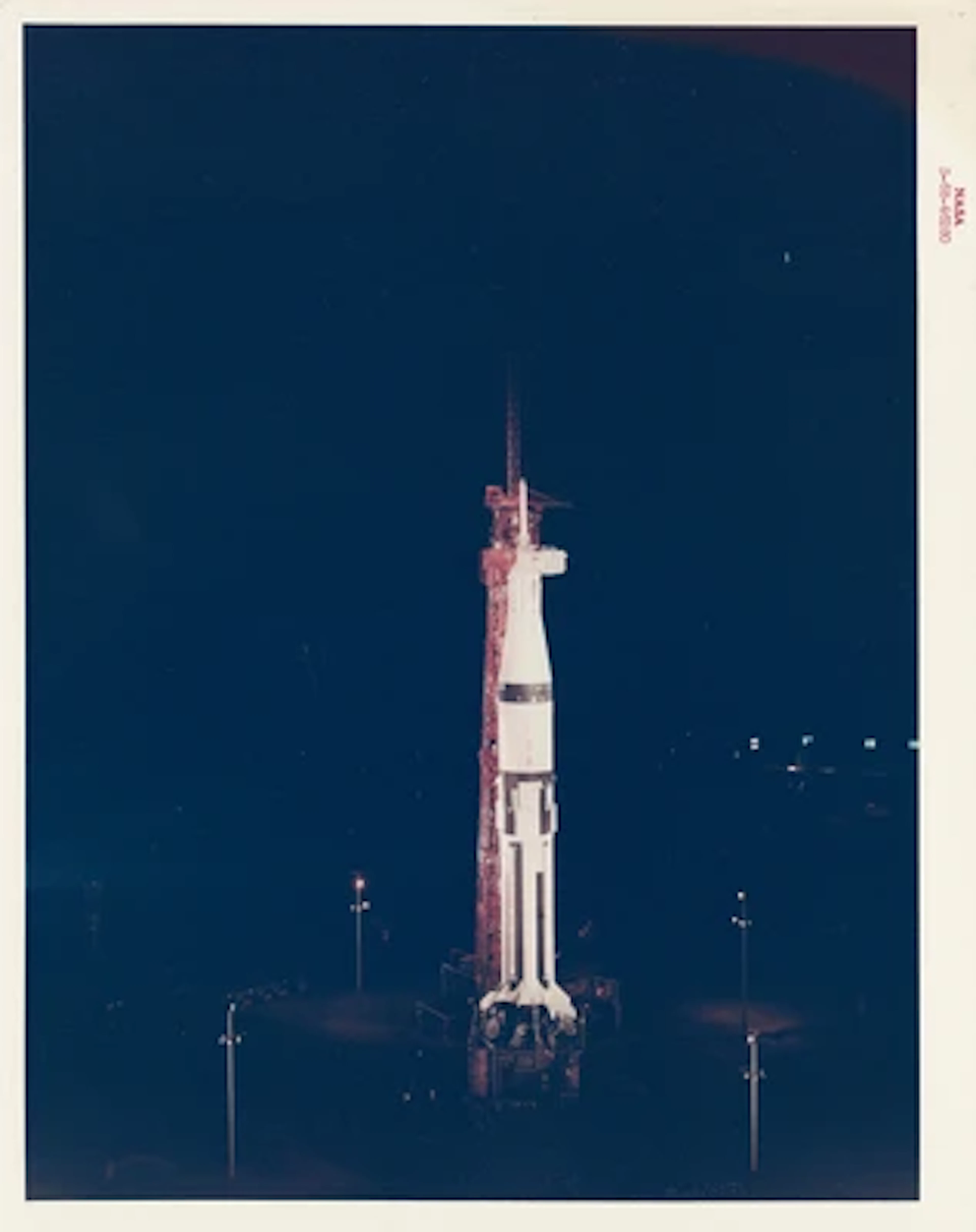 APOLLO 7 - The First Crewed Apollo Spacecraft Awaits Launch at Night