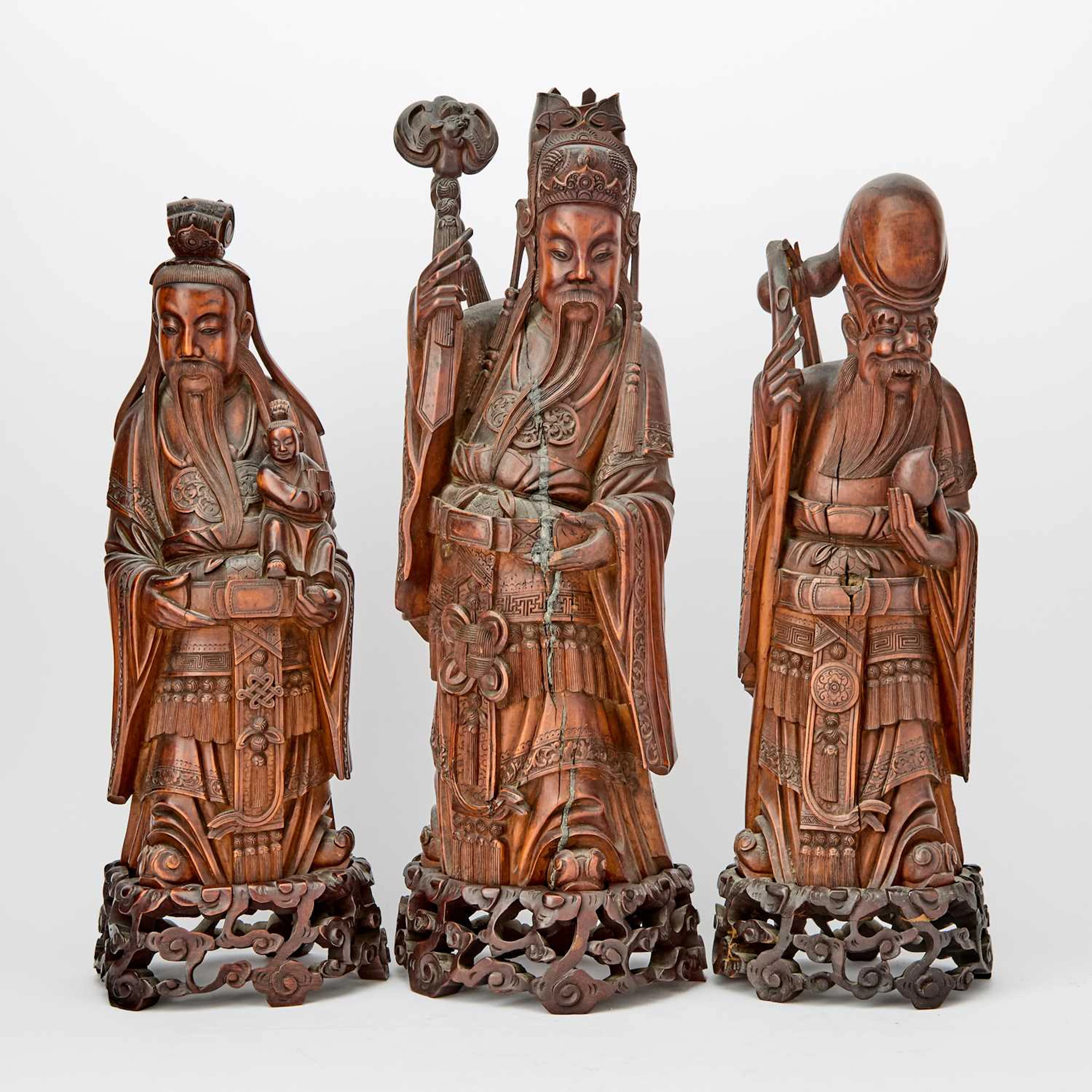 A Group of Chinese Carved Wood Figures of Fu, Lu, and Shou 19th century